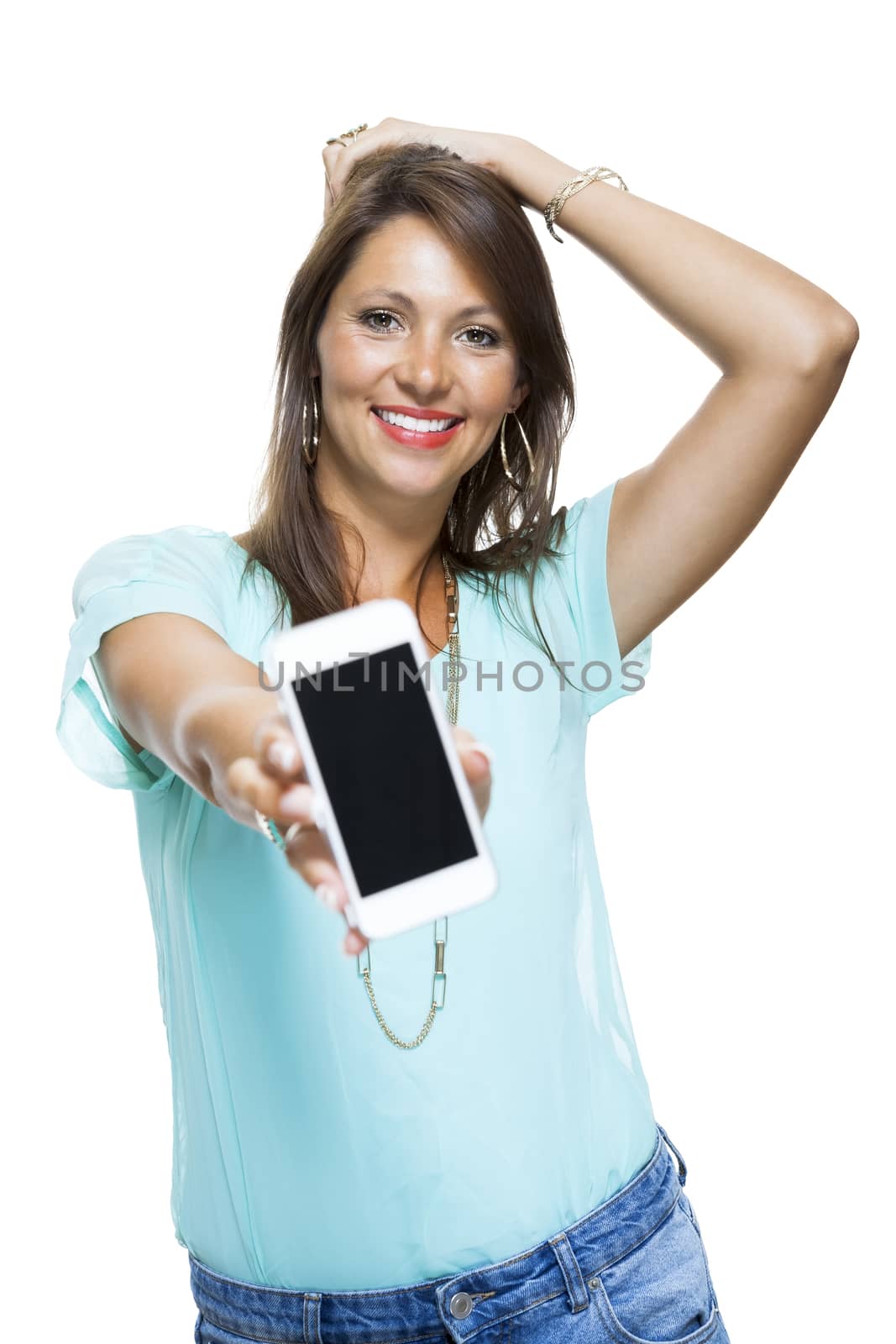 Portrait of Pretty Happy Woman in Casual Clothing Looking Something at her Mobile Phone on Hand. Captures in Studio with White Background.