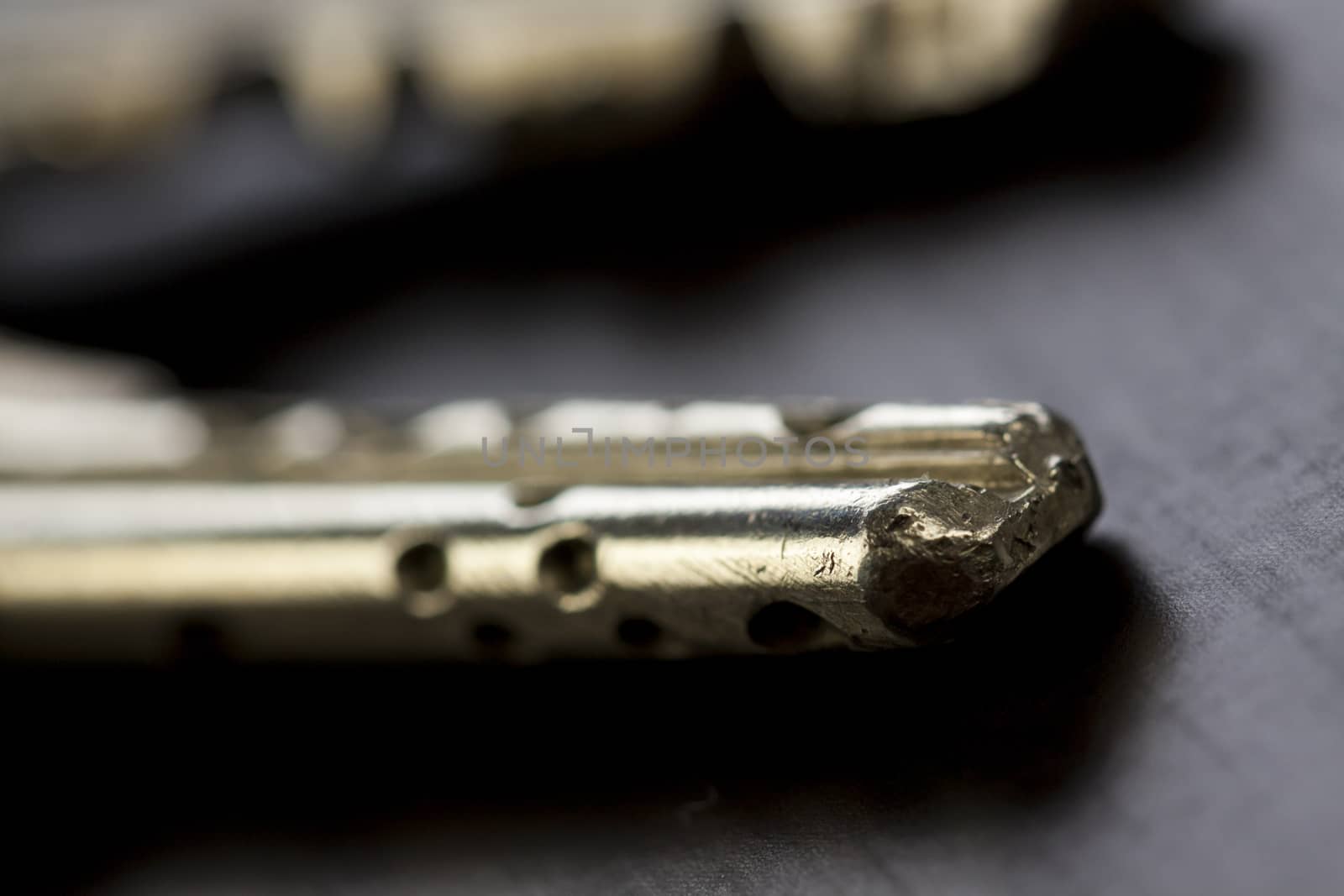 Macro Shot of Conceptual House Keys on Top of Wooden Table