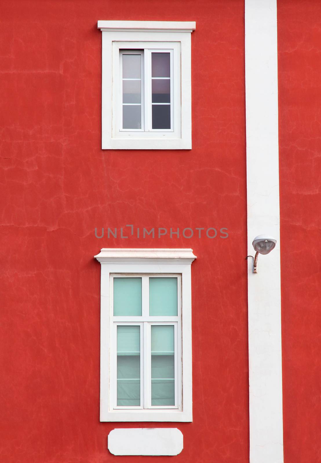 Spain. Canary Islands. Gran Canaria island. Las Palmas de Gran Canaria. Detail of ochre facade with two windows