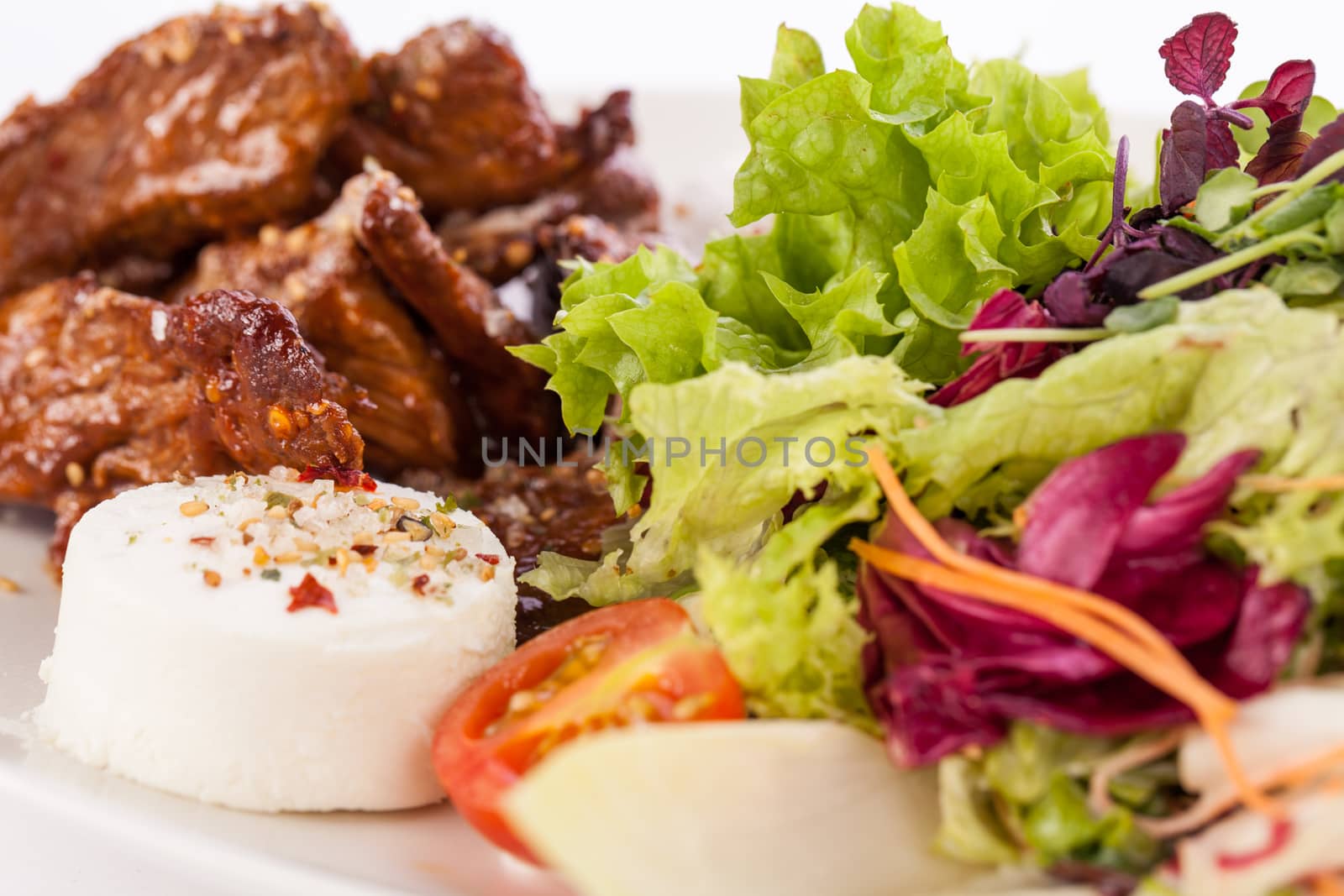 grilled beef stripes fresh mixed salad and warm goat cheese