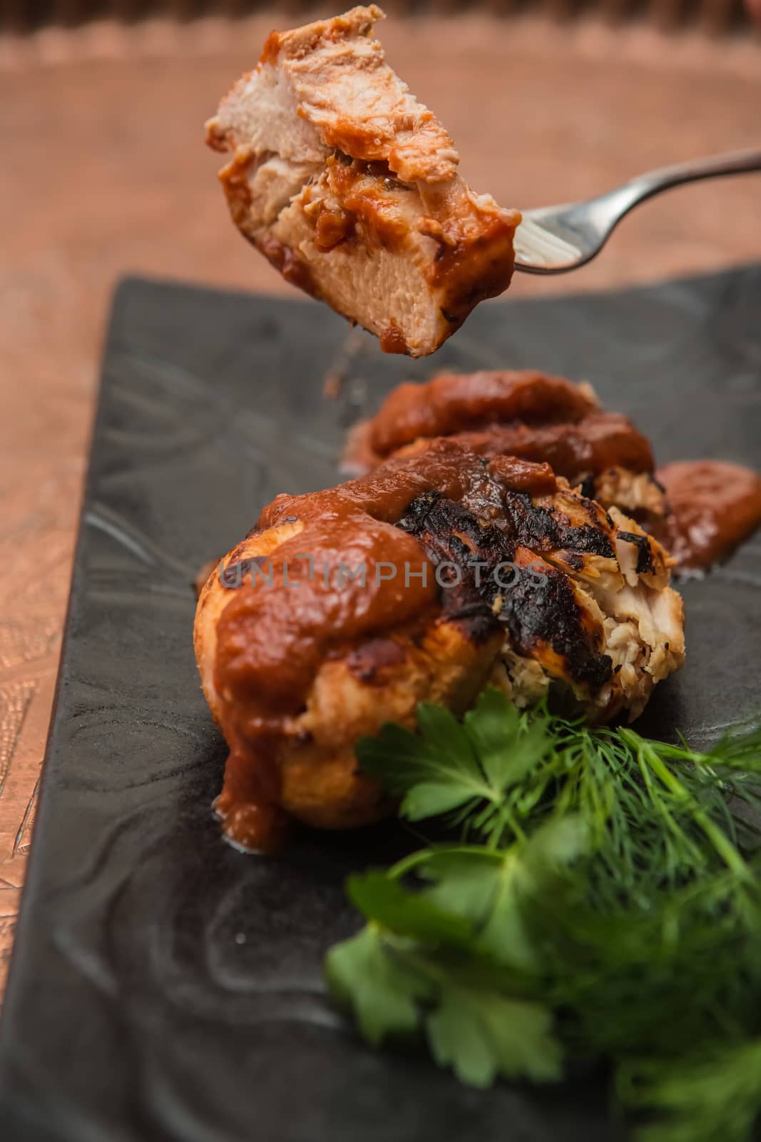 the cut chicken fillet baked in spices and tomato sauce,international kitchen