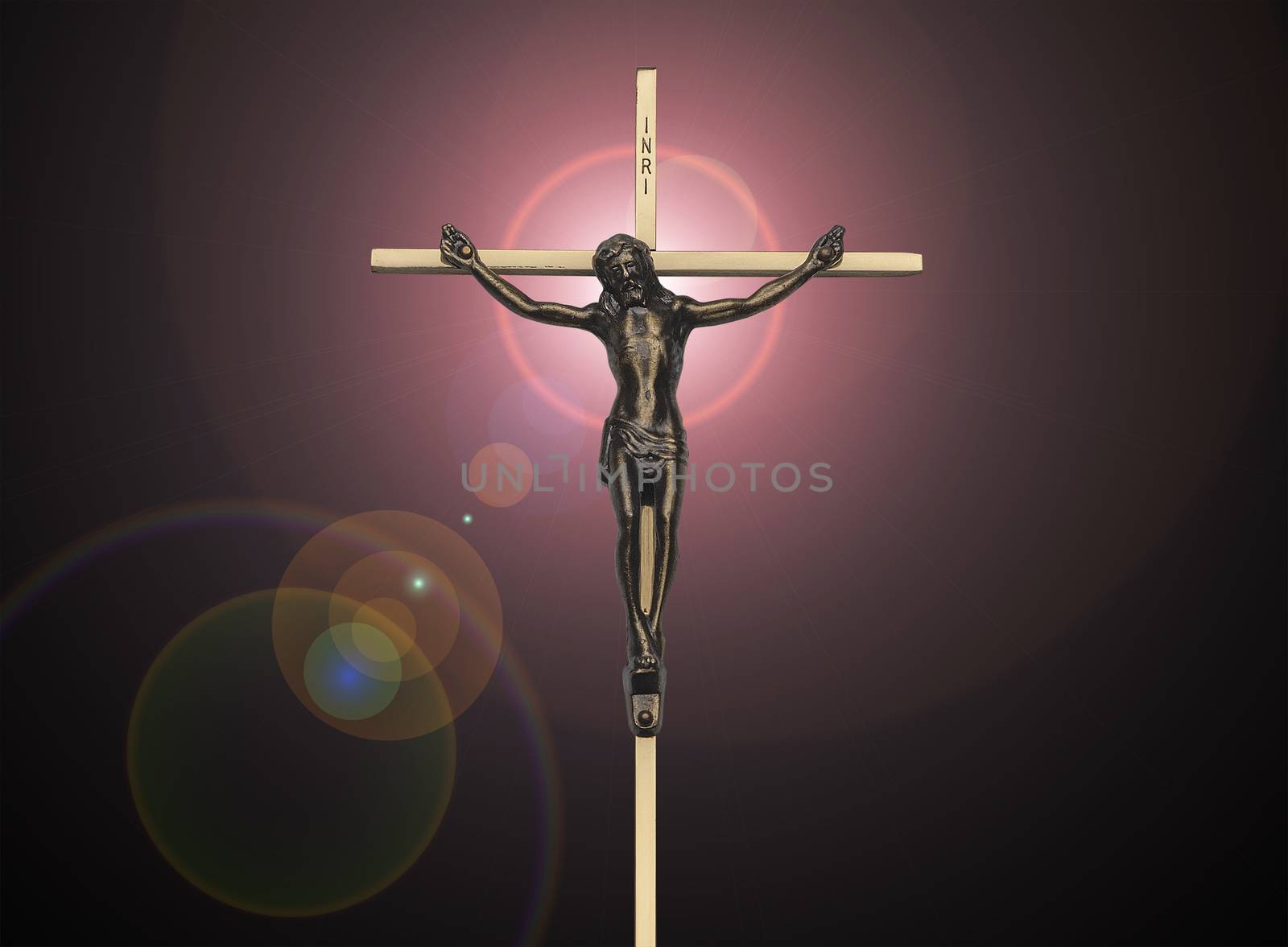 Jesus Christ passion on the cross on black with pink lens flare