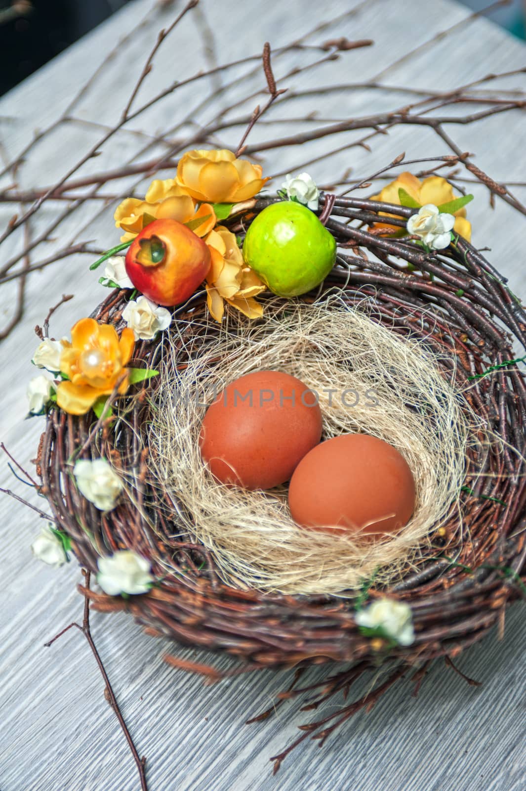 eggs in nest on a wooden background for easter