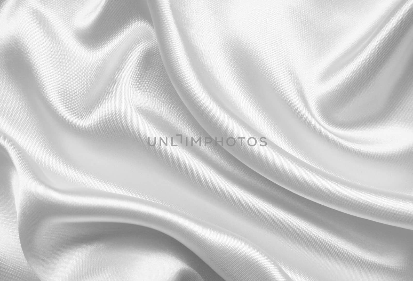 Smooth elegant white silk or satin can use as wedding background 