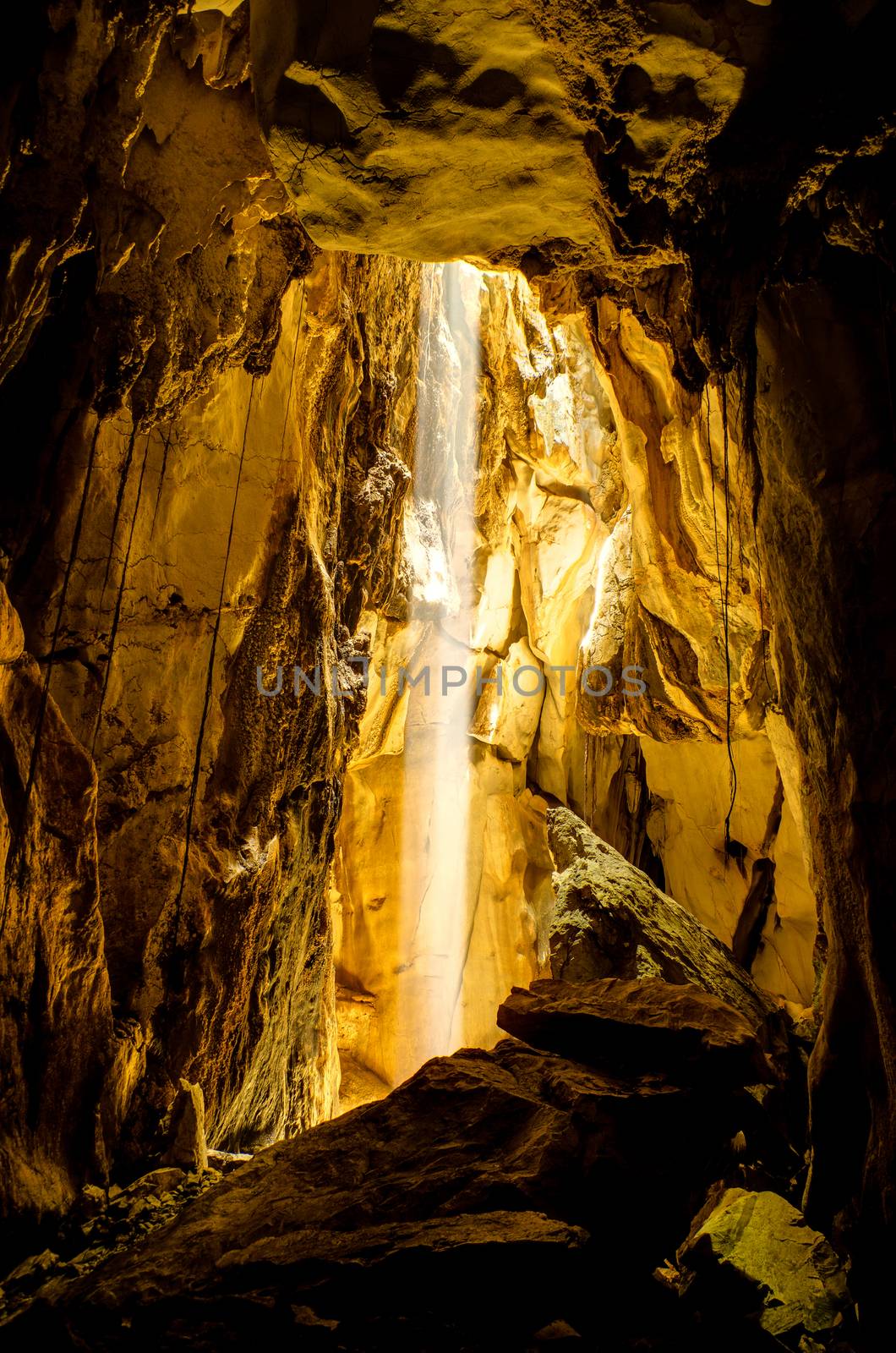 Sun beam in dark cave, Lopburi, Thailand. HDR