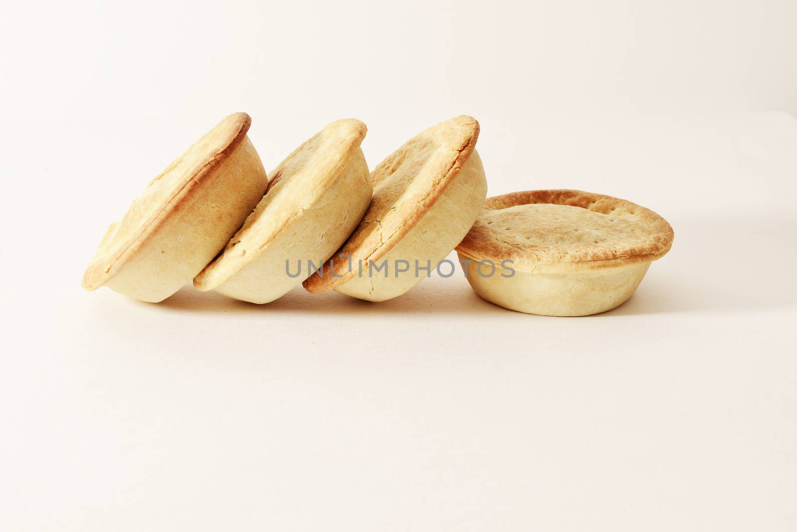 Stack of meat pies freshly baked.