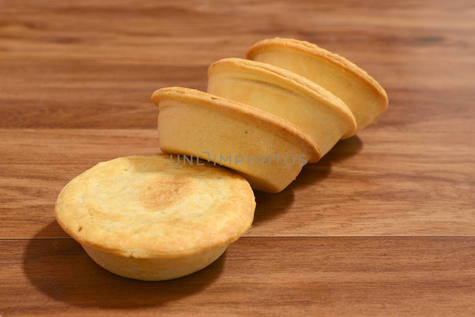 Stack of meat pies freshly baked.