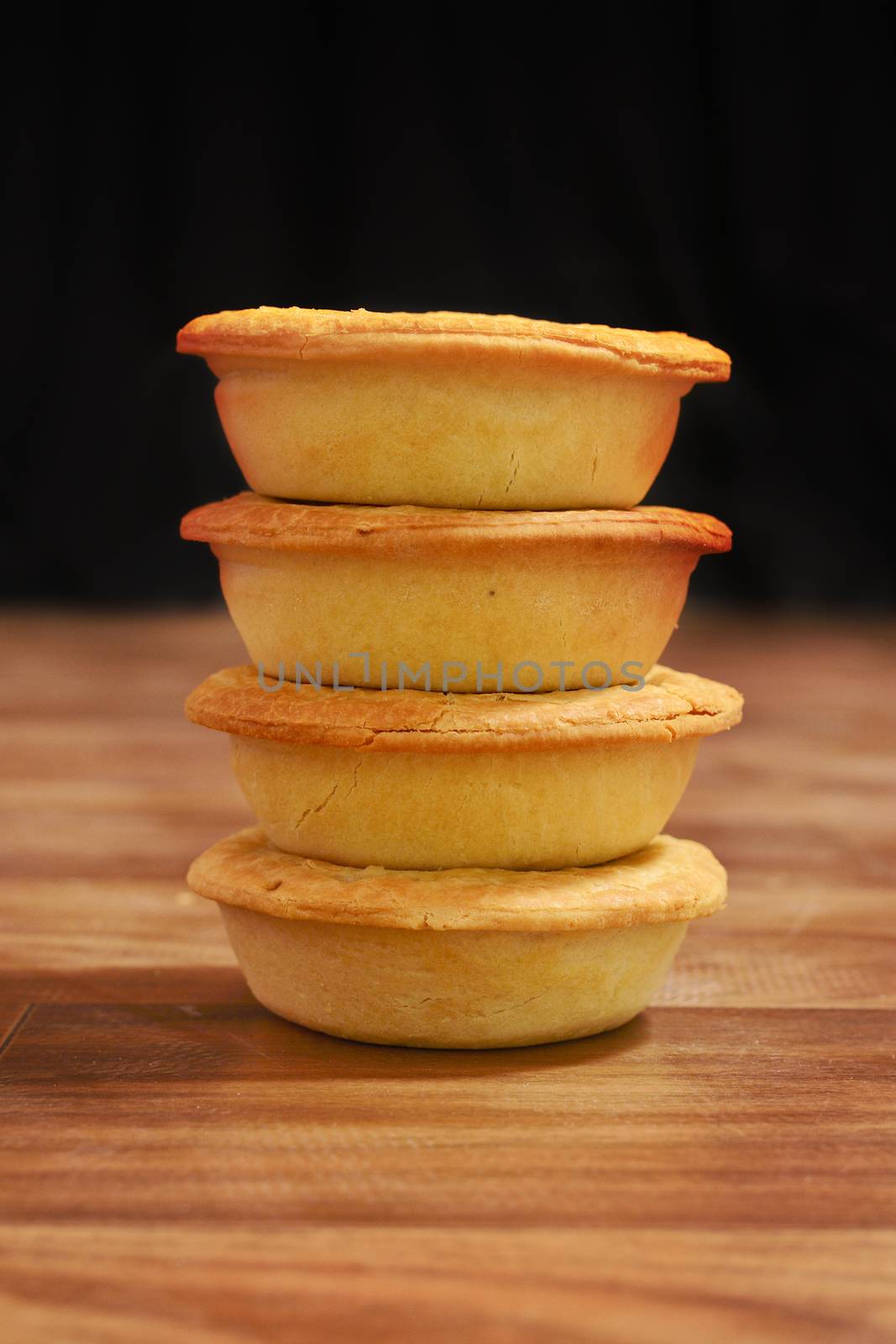 Stack of meat pies freshly baked.