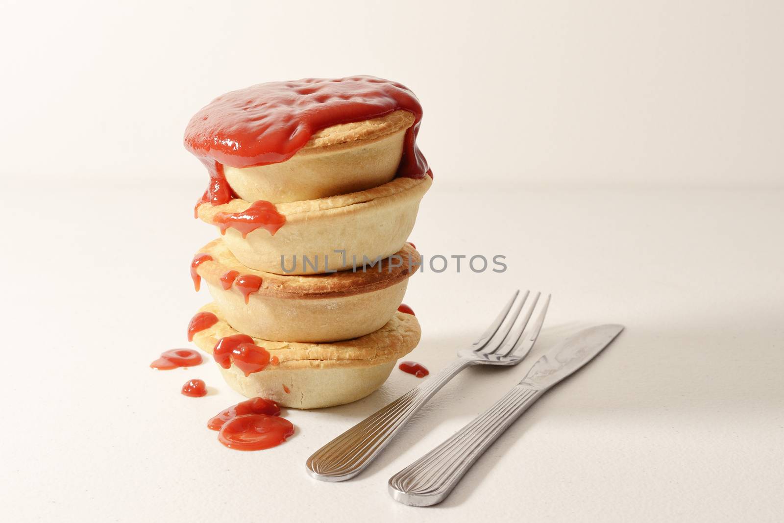 Stack of meat pies freshly baked.