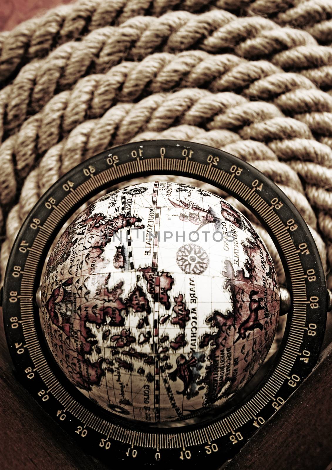 Compass on old map, ambient light travel theme by JanPietruszka