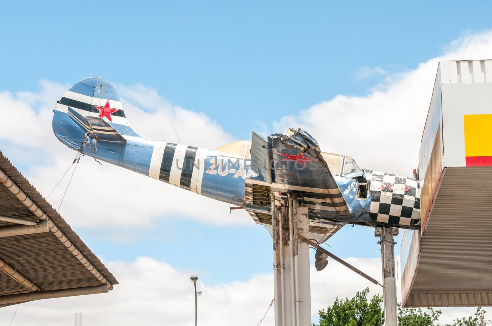 TOUWS RIVER, SOUTH AFRICA - DECEMBER 2, 2014: An aeroplane wreck mounted in such a way as if it hit the roof at a local gas station