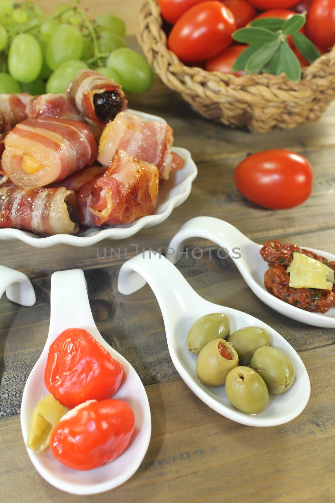 Tapas stuffed with prunes, figs, apricots on wooden background