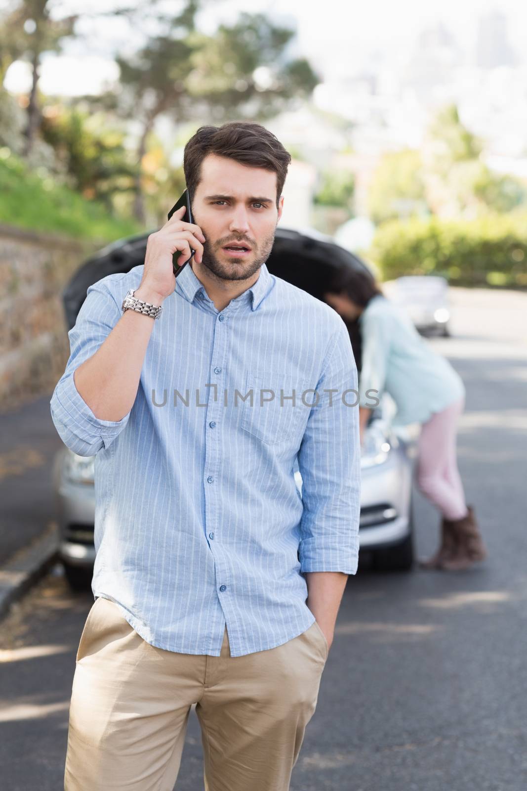 Young couple after a car breakdown by Wavebreakmedia