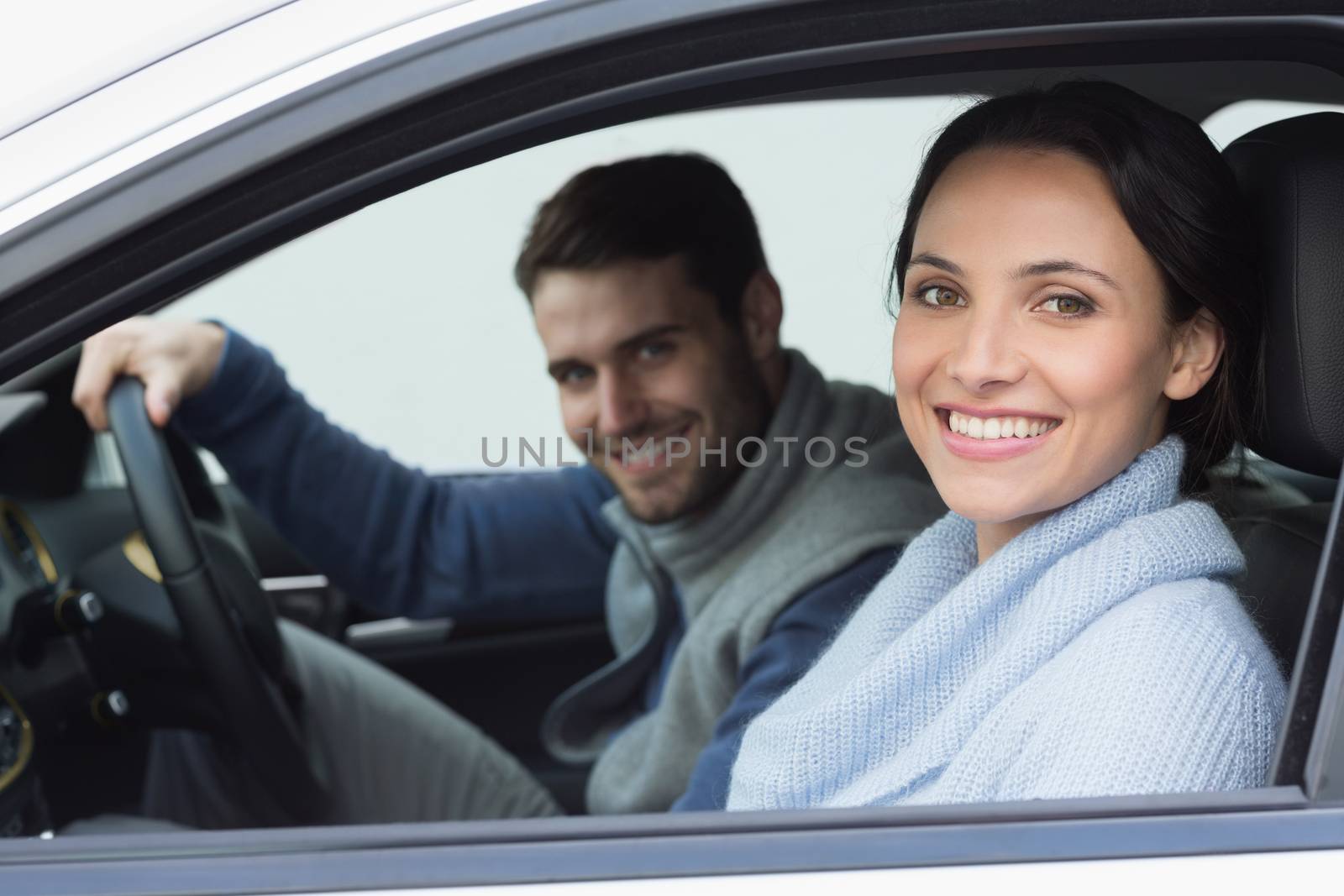 Young couple going for a drive in their car