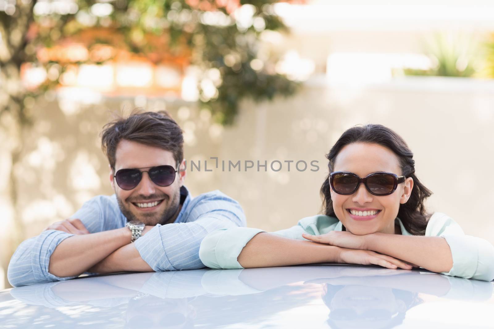 Young couple smiling at the camera by Wavebreakmedia