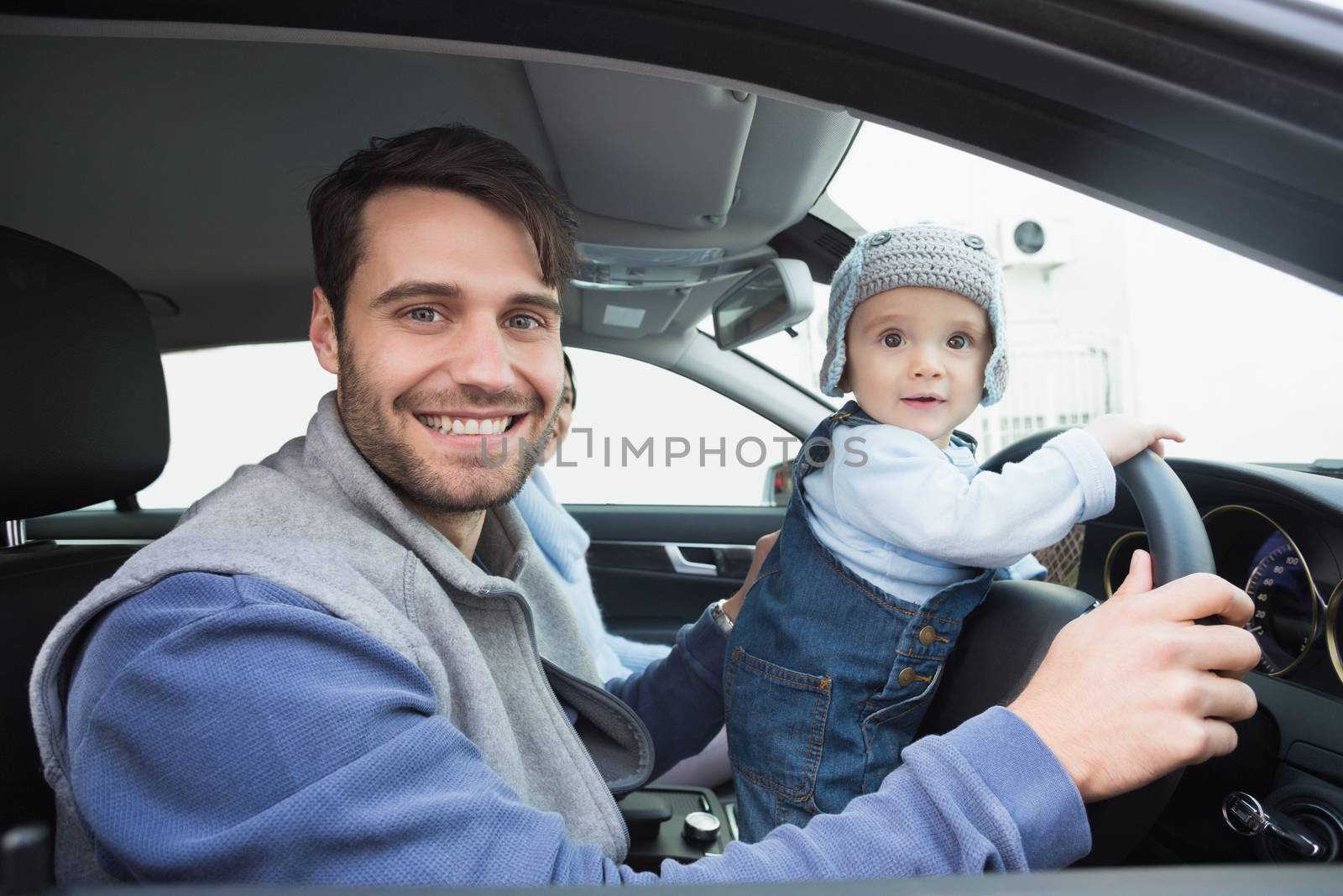 Young family going for a drive  in their car