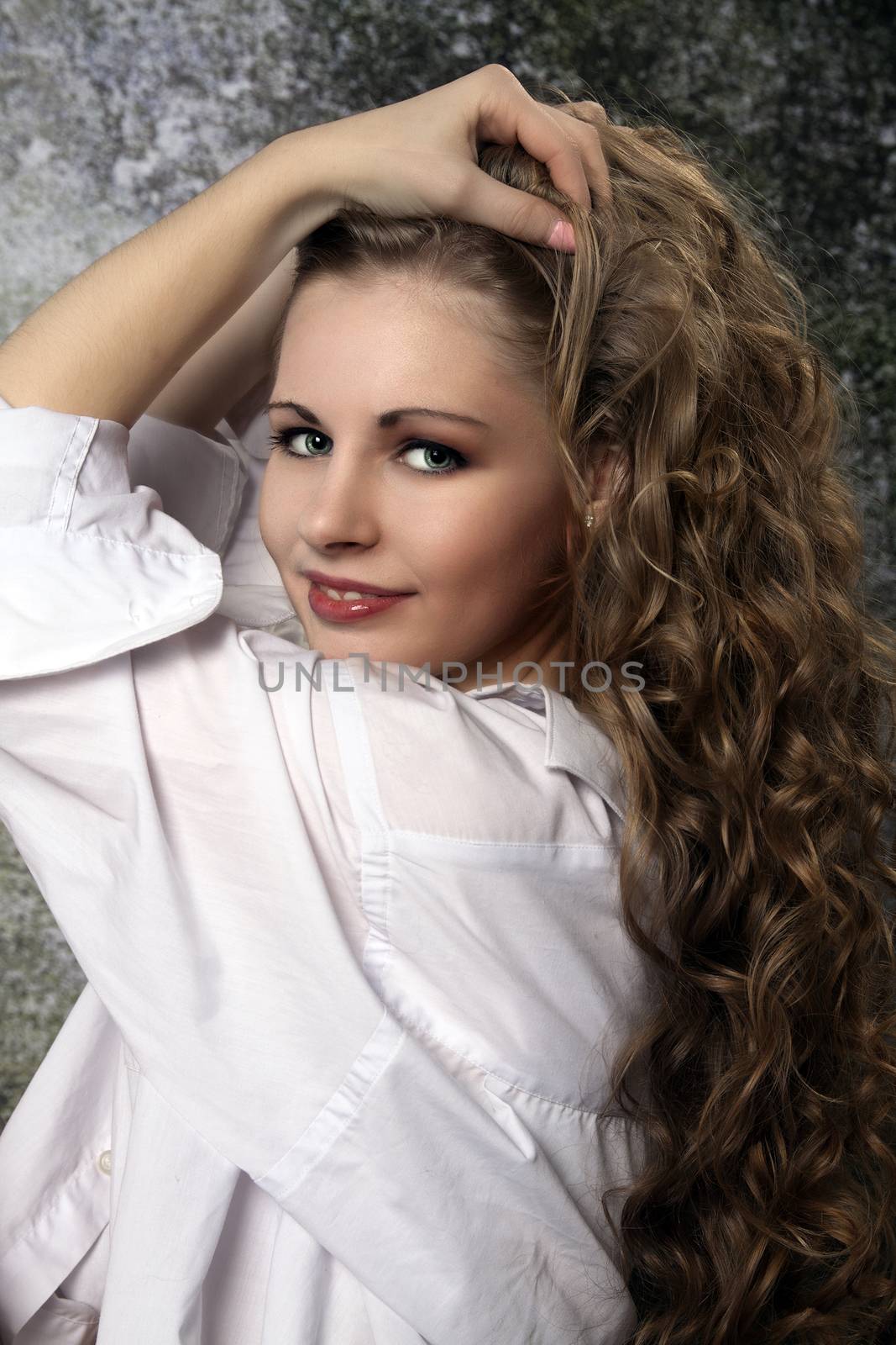 Young long-haired curly blonde woman by maros_b