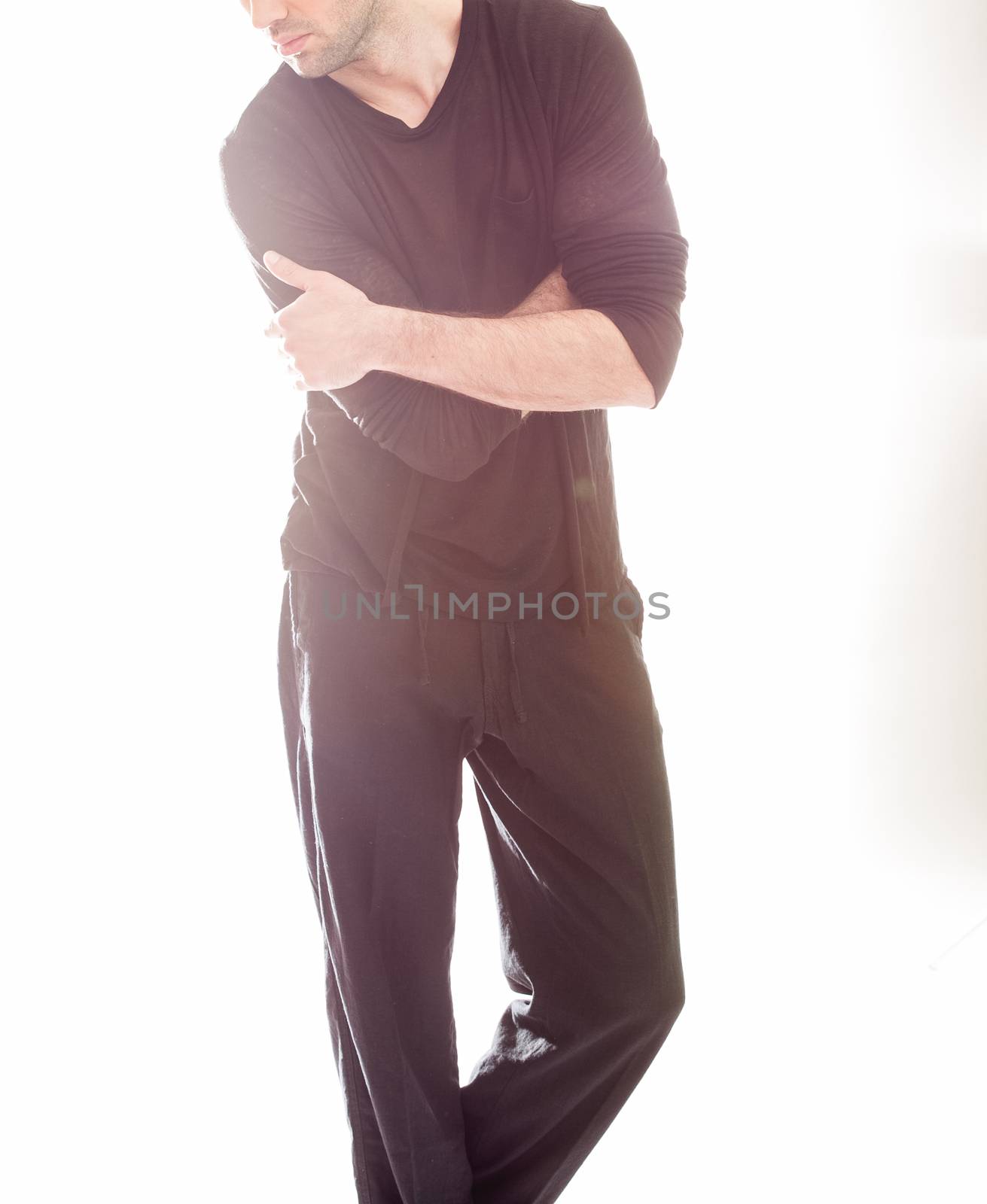 Elegant young handsome man in black clothing. Studio fashion portrait.