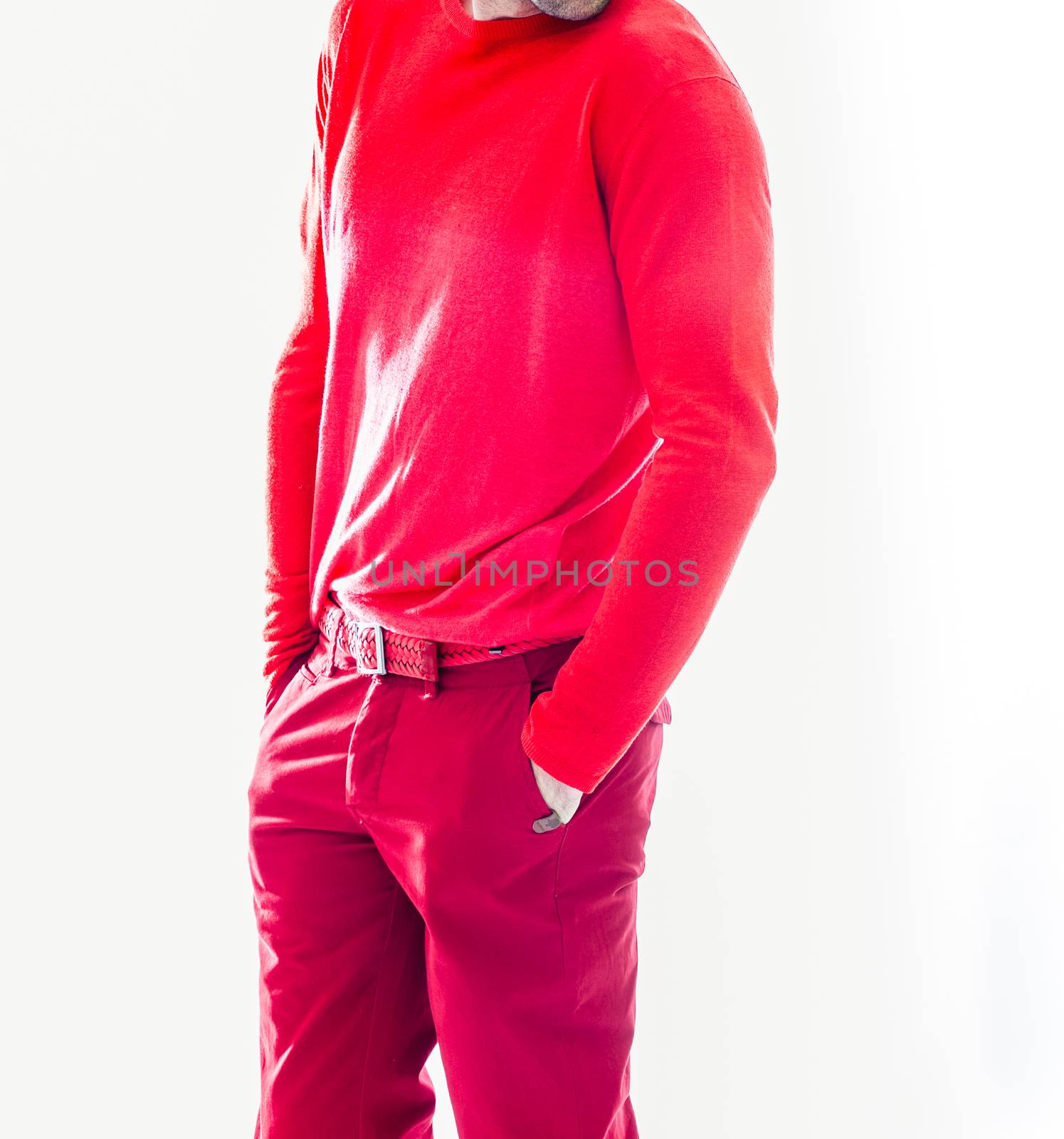 Elegant young handsome man in red clothing. Studio fashion portrait.