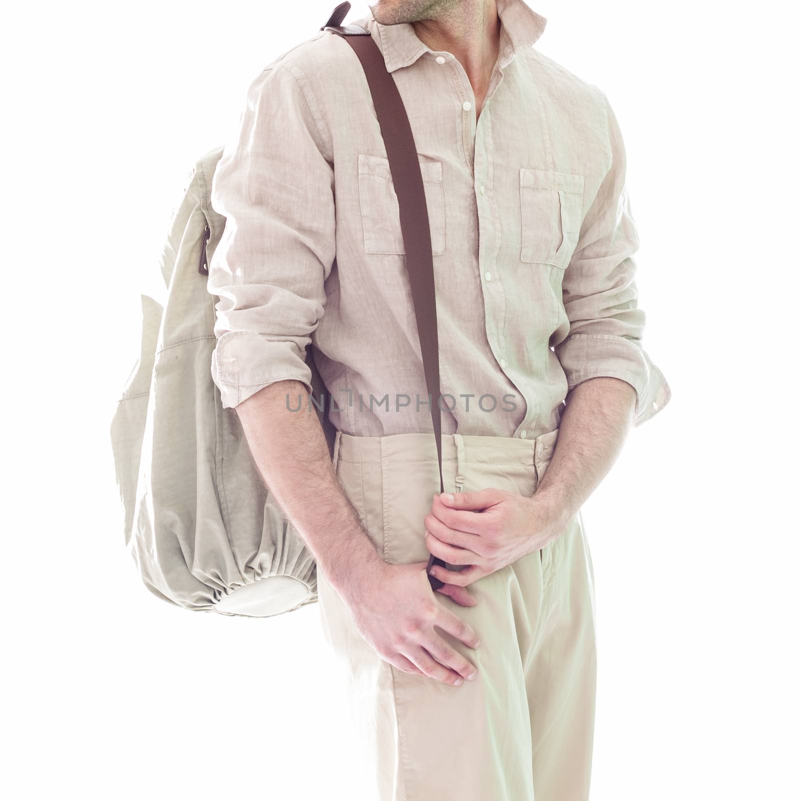 Elegant young handsome man  in white clothing. Studio fashion portrait.