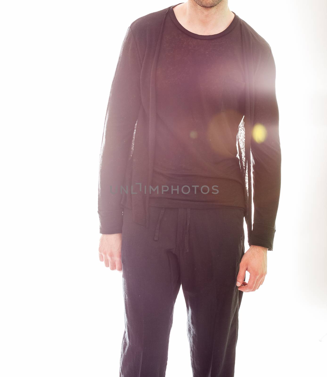 Elegant young handsome man in black clothing. Studio fashion portrait.