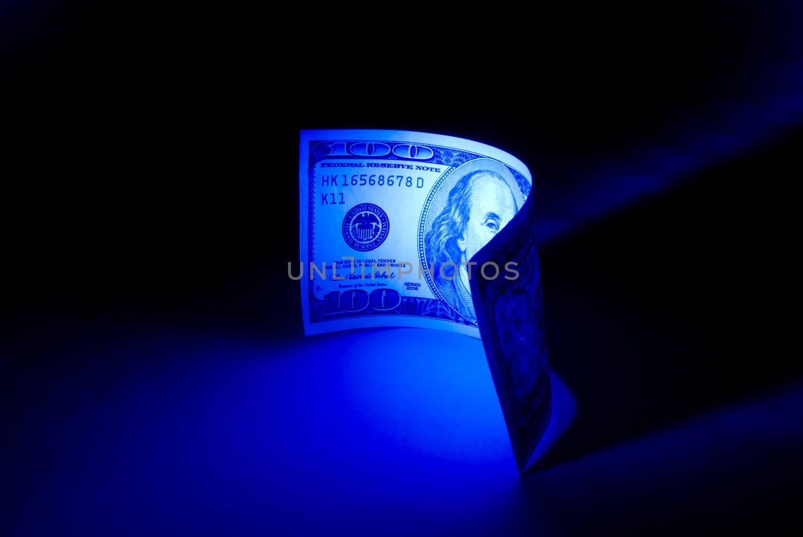 Hundred dollars. 
Beautiful art illumination. A dark blue background.