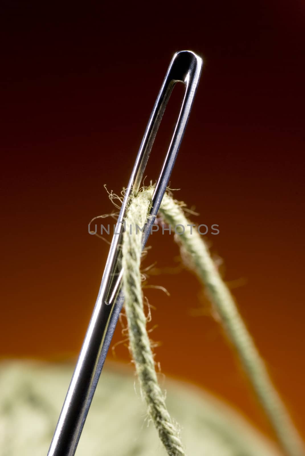 Metal needle and string. Very much a close up.
Art background.