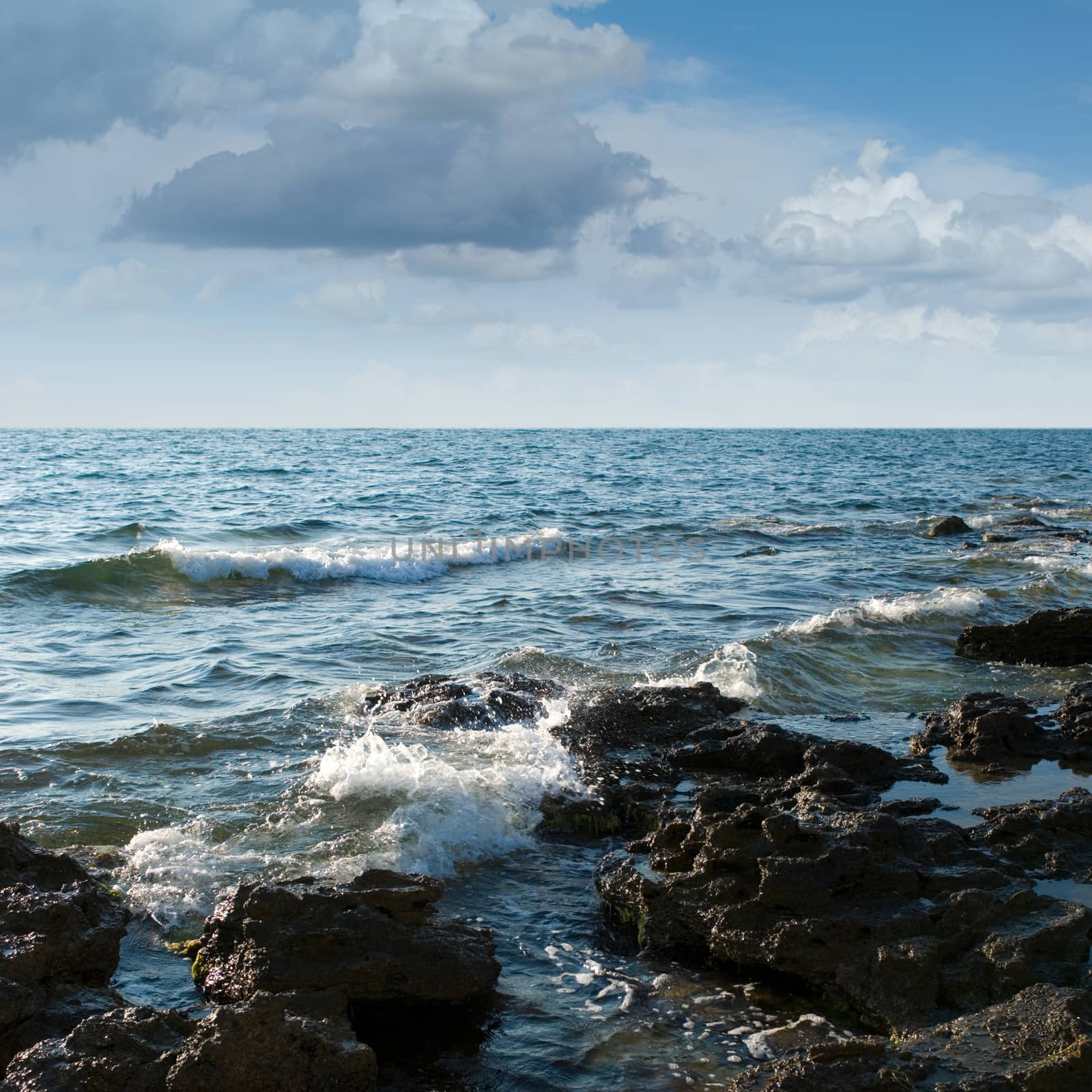 Black Sea coast, rocks, stormy sky (summer day).