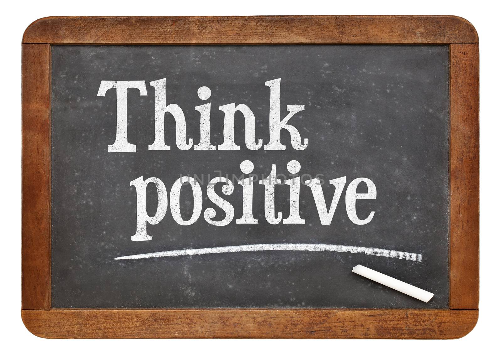 Think positive - inspirational words on a vintage slate blackboard