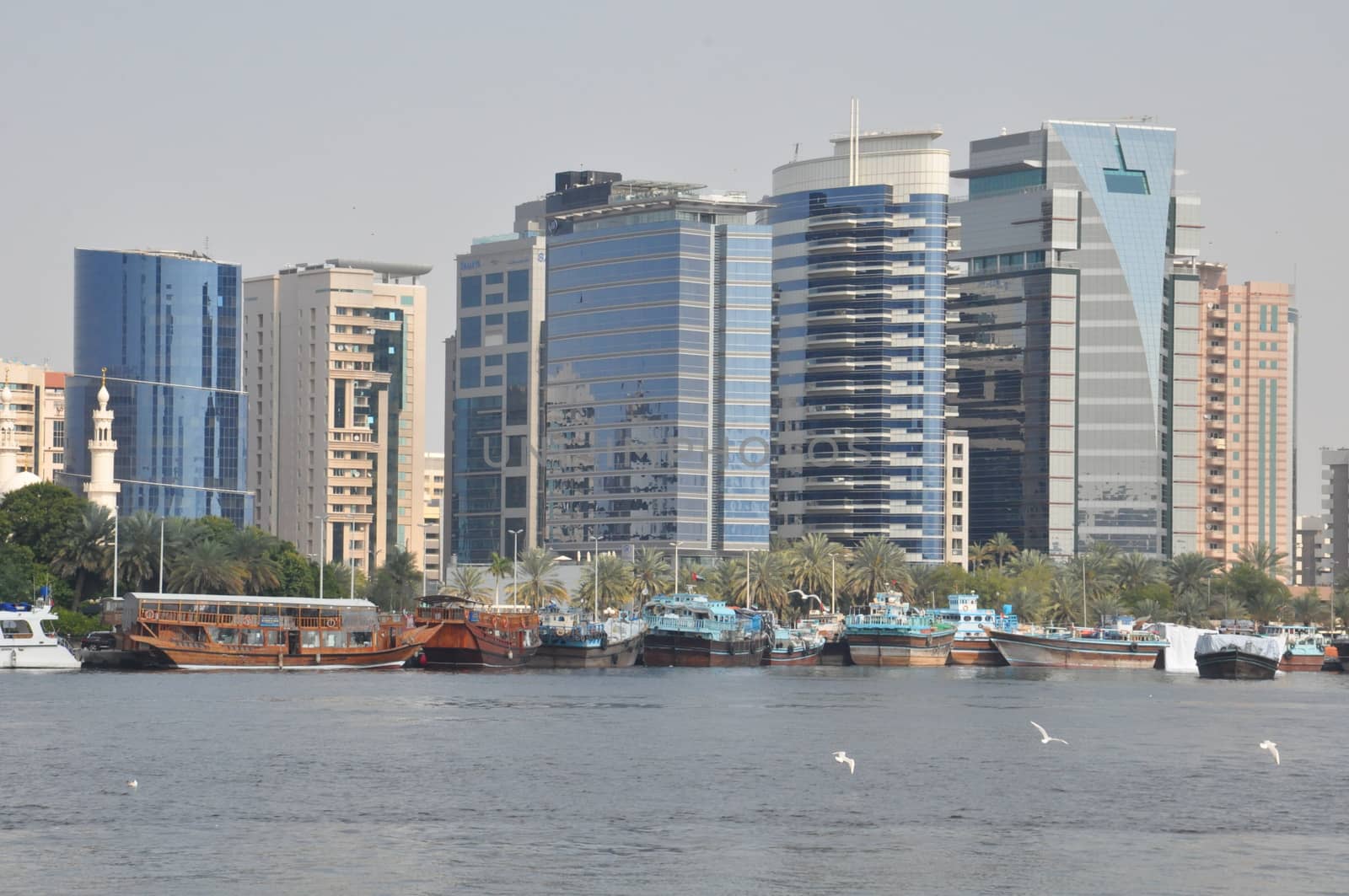 Dubai Creek in Dubai, UAE. The notable buildings along the Deira Creek are Deira Twin Towers, Dubai Creek Tower, National Bank, and Chamber of Commerce.