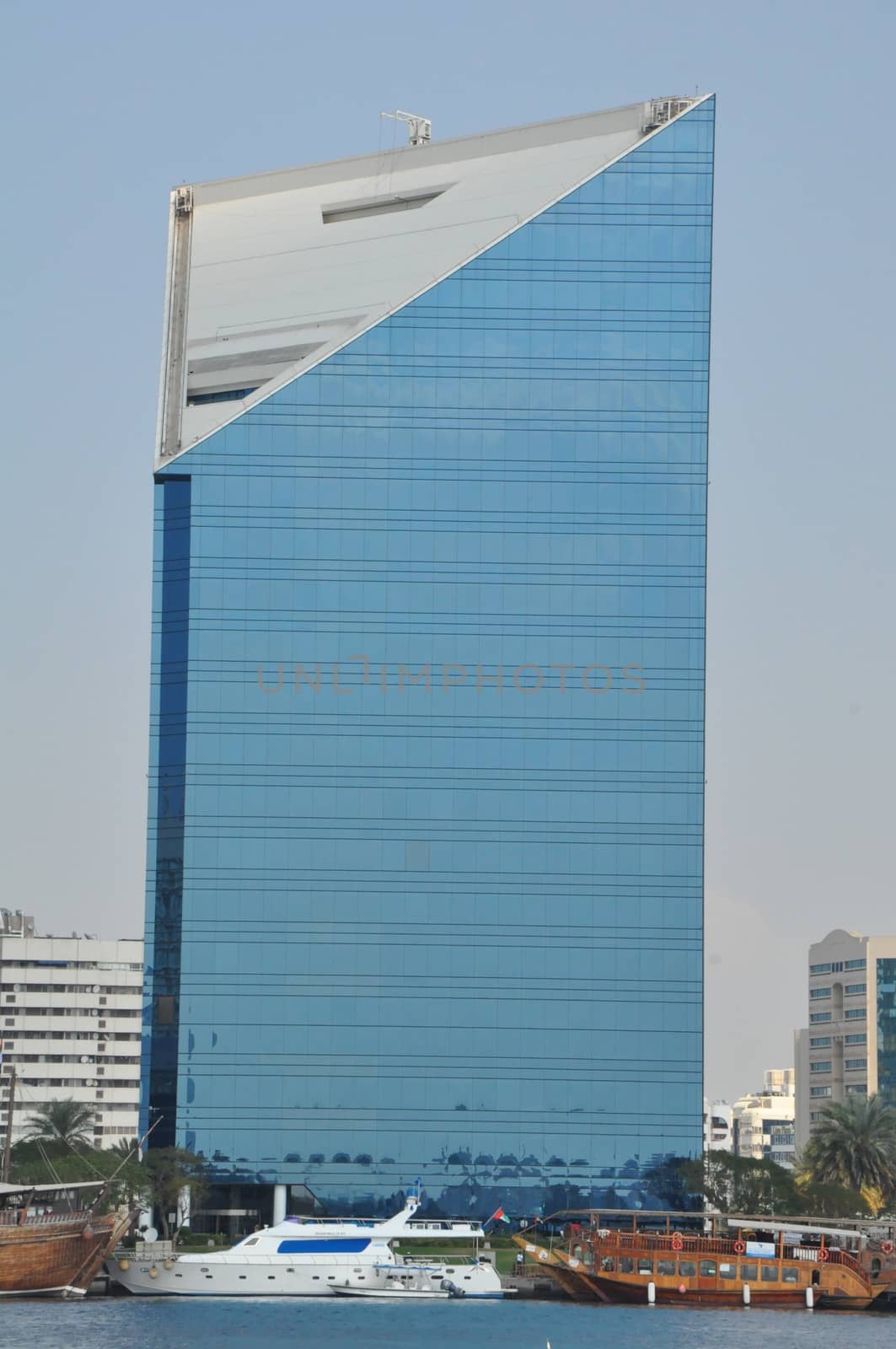 Dubai Creek in Dubai, UAE. The notable buildings along the Deira Creek are Deira Twin Towers, Dubai Creek Tower, National Bank, and Chamber of Commerce.