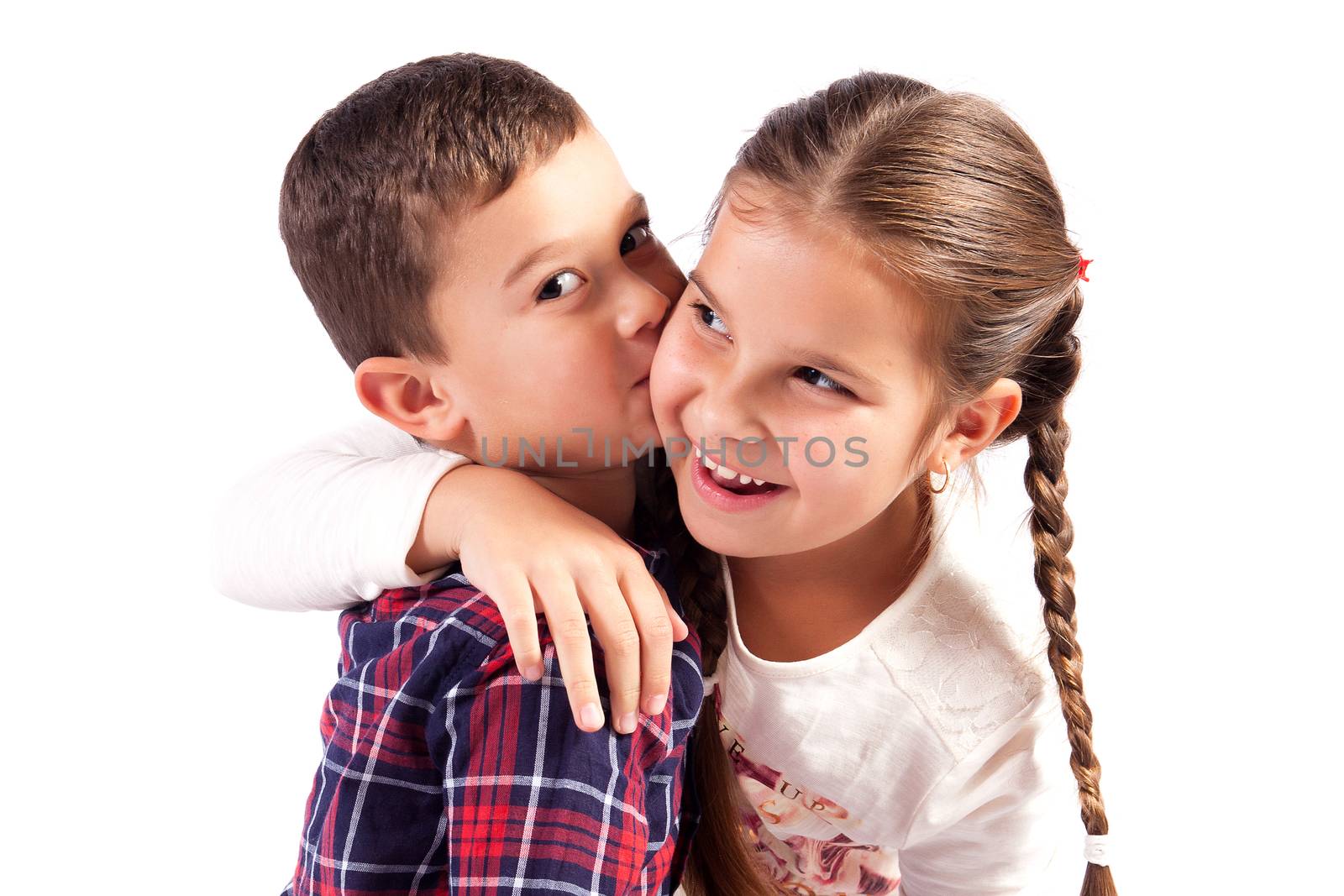 Brother and sister in a hug, smiling