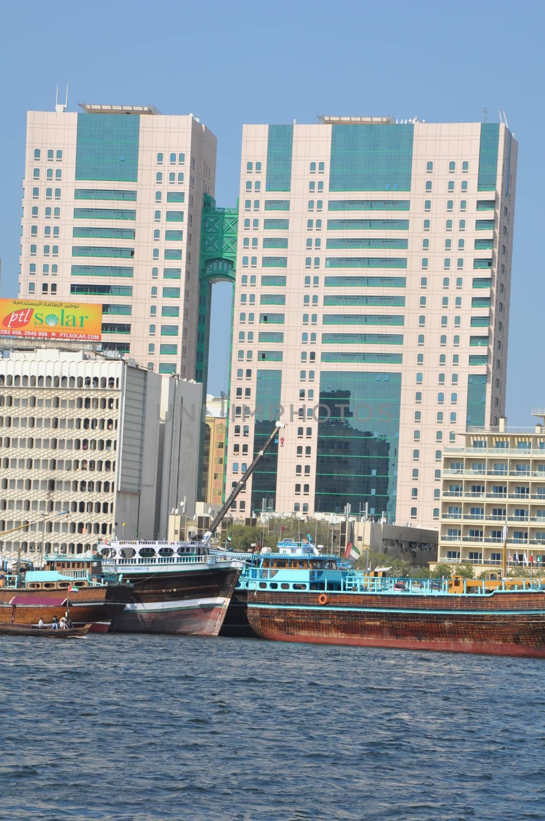 Dubai Creek in Dubai, UAE. The notable buildings along the Deira Creek are Deira Twin Towers, Dubai Creek Tower, National Bank, and Chamber of Commerce.