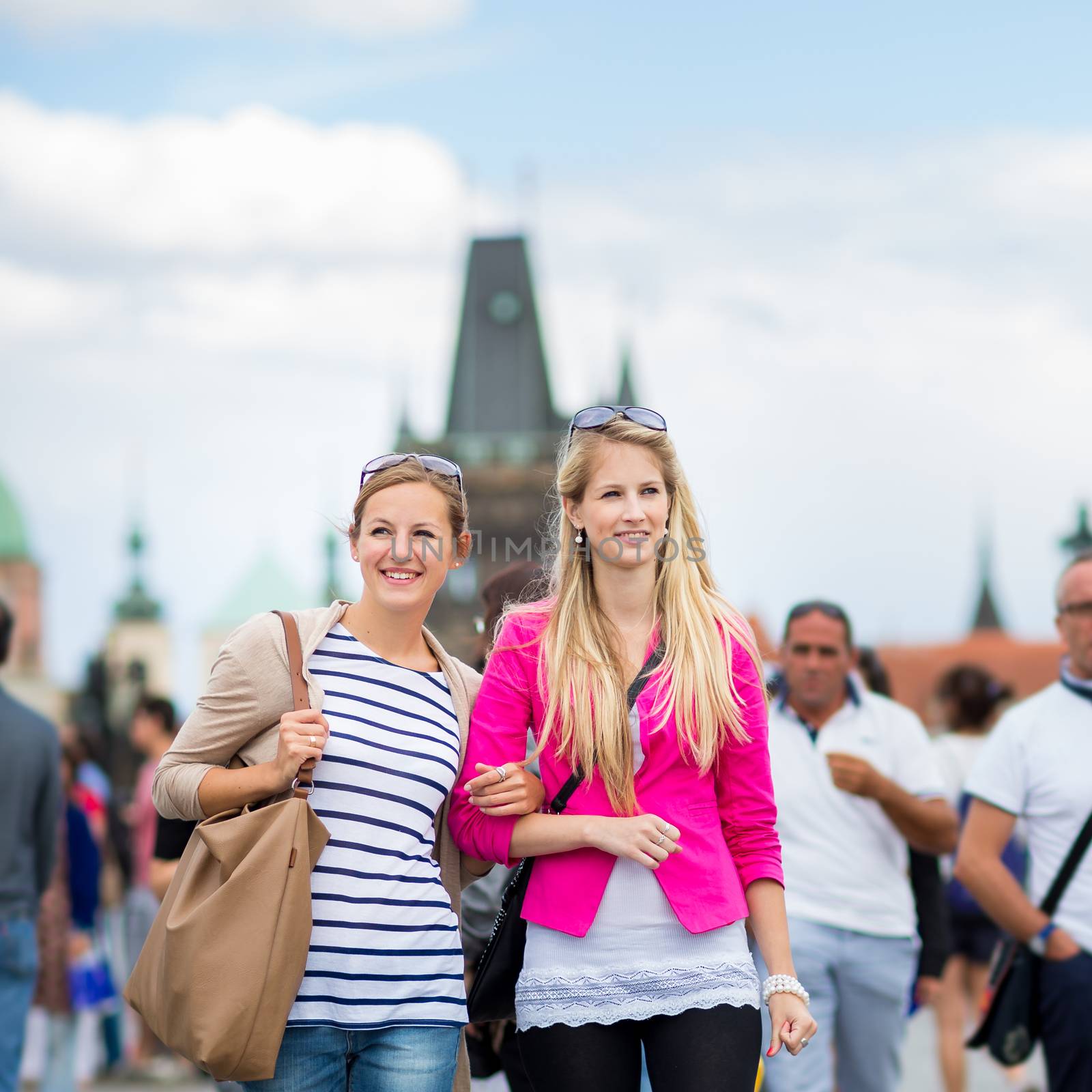 Two pretty, young women sightseeing in Prague historic center by viktor_cap