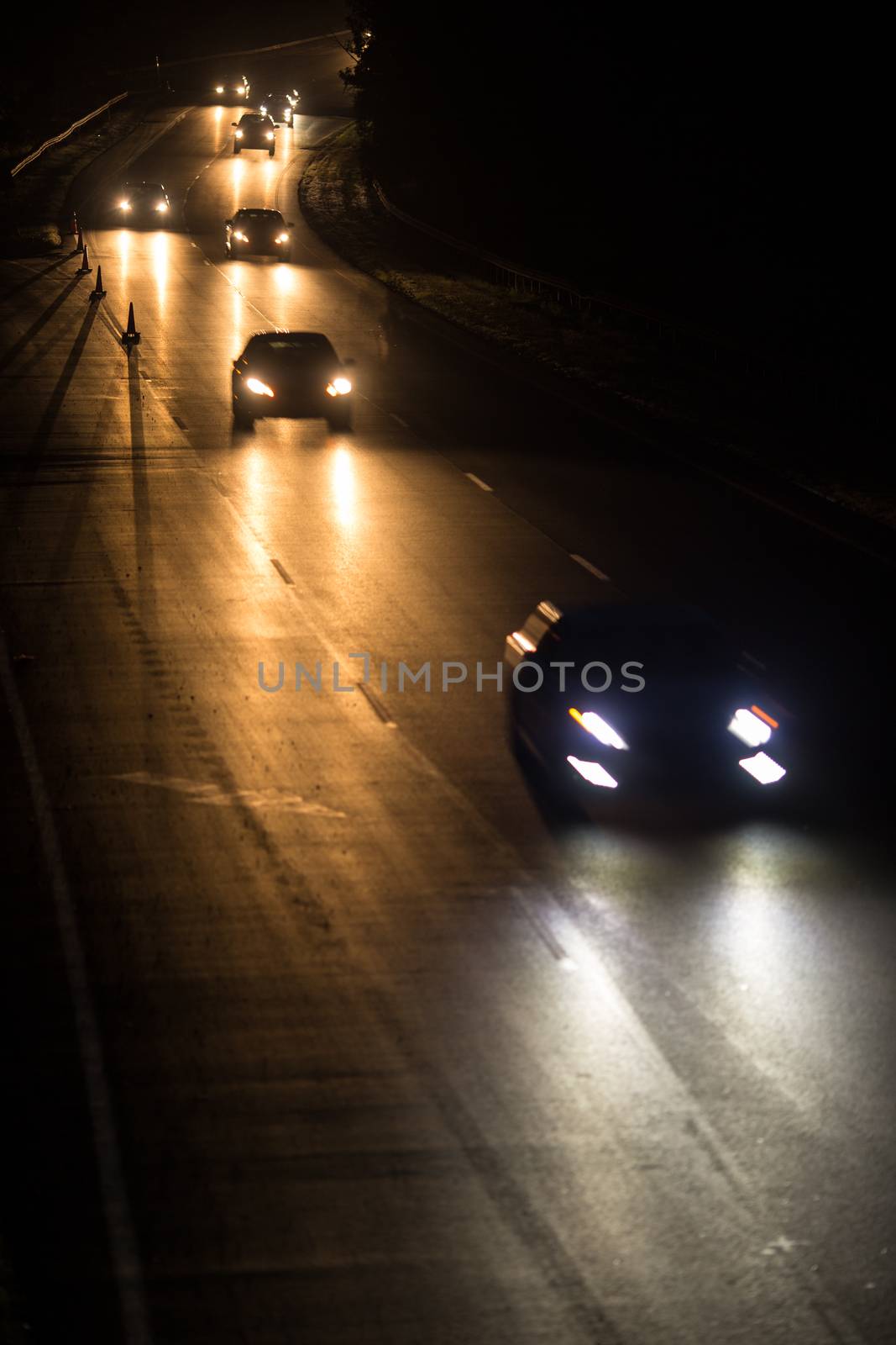 Busy highway at night with cars by viktor_cap