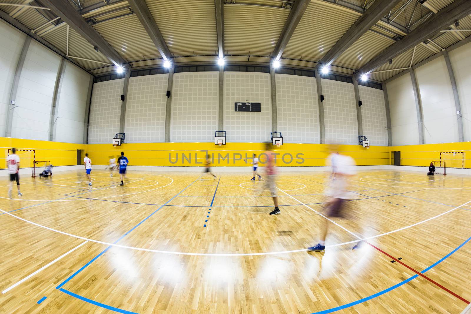 interior of a modern multifunctional gymnasium with young people by viktor_cap