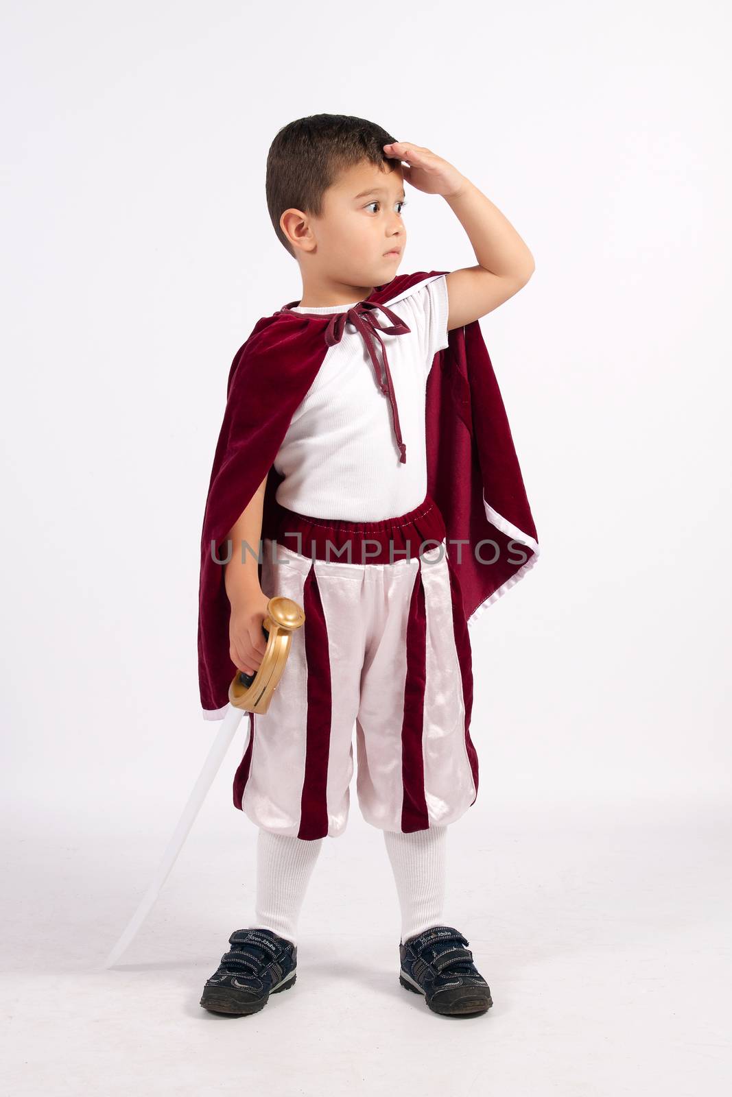 Boy dressed in an oblique Prince, holding in his hand a sword