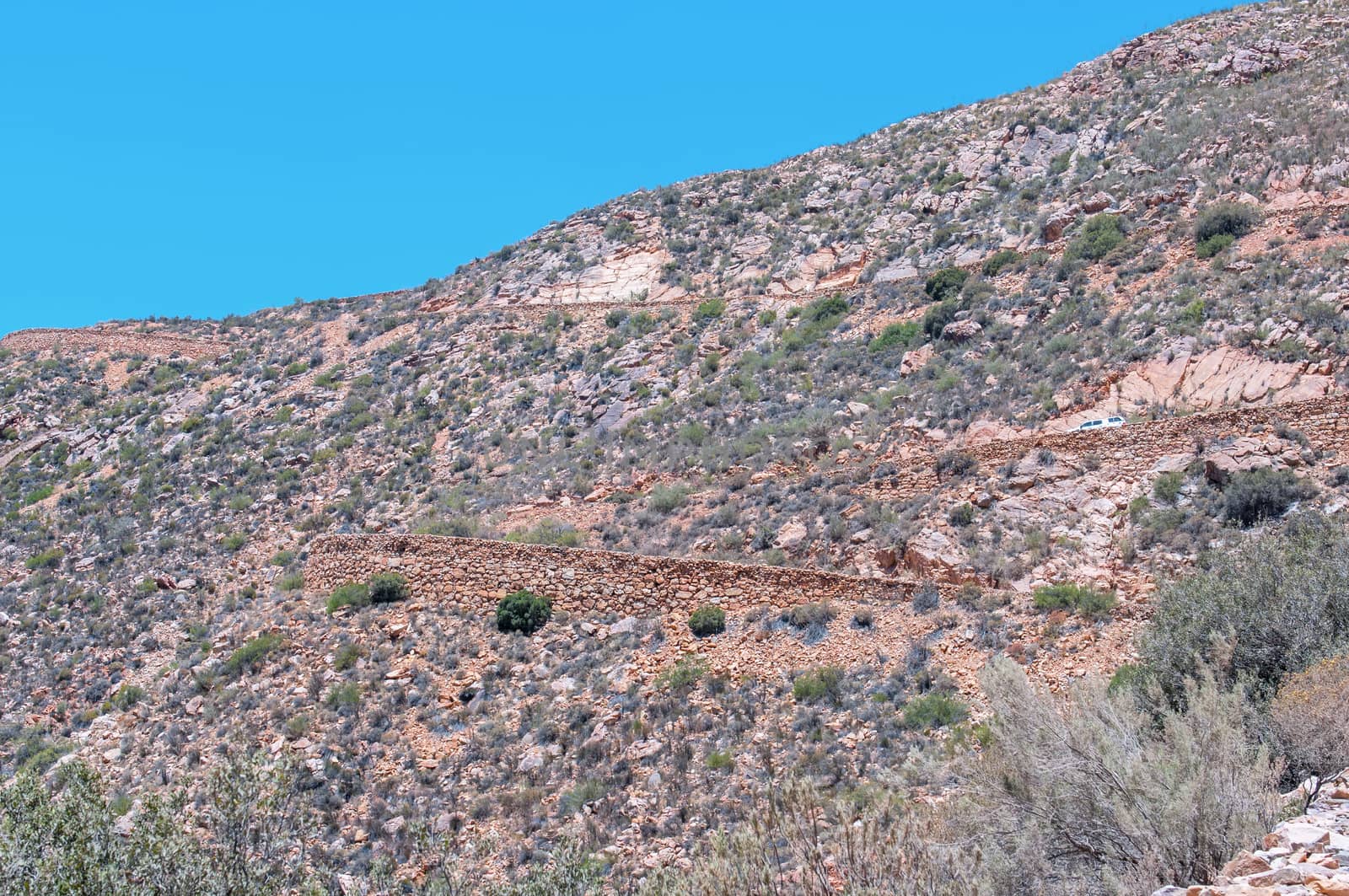 SWARTBERG PASS, SOUTH AFRICA - JANUARY 2, 2015: Hairpin bends in the historic Swartberg (Black Mountain) Pass. The pass is a declared national monument.