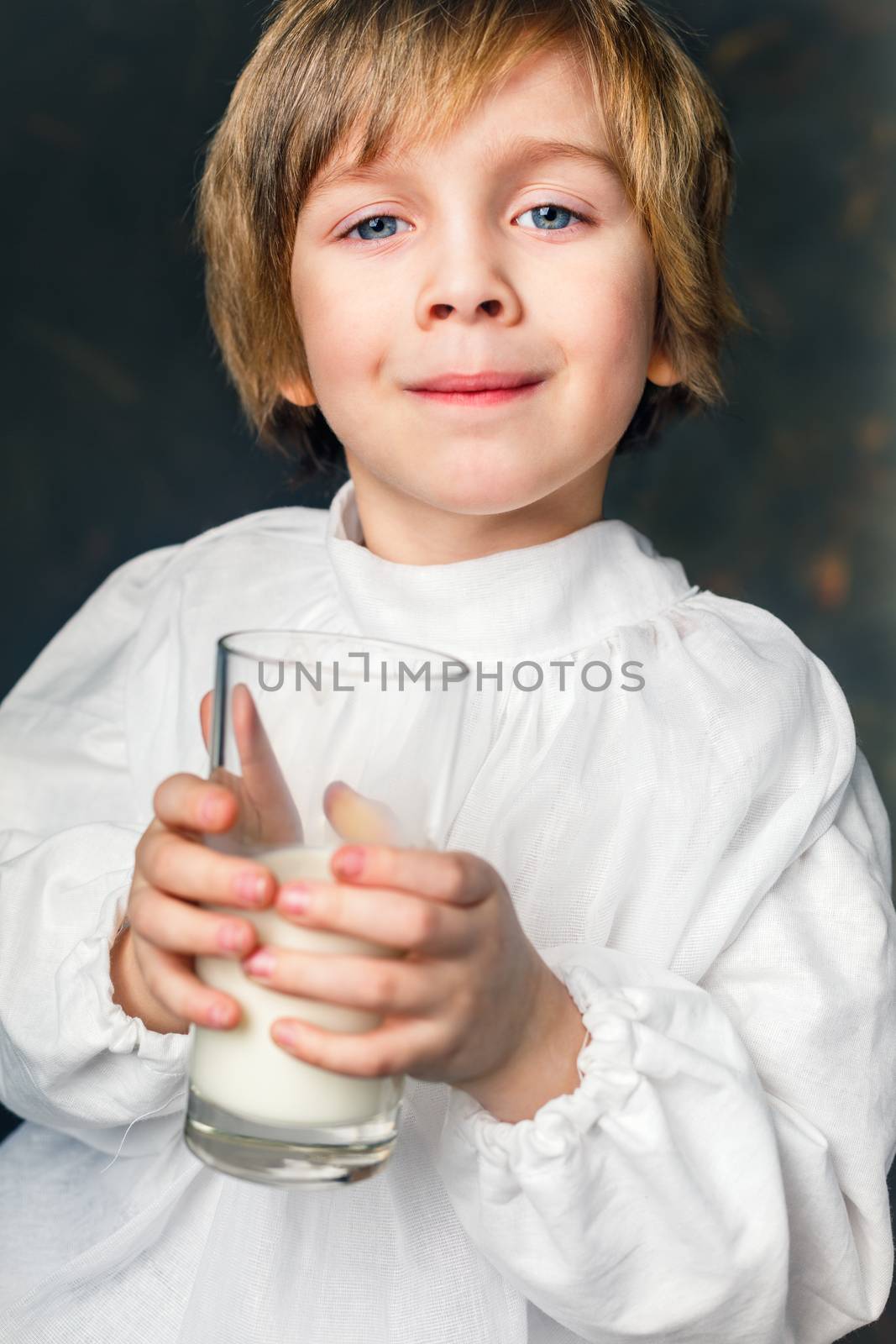 kid drinks a glass of milk by anelina