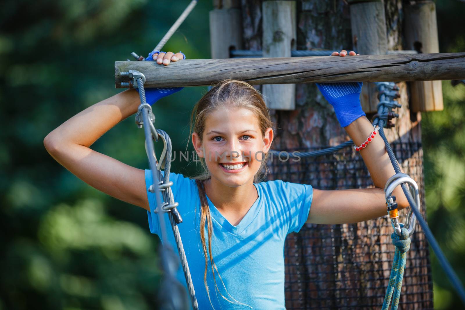 Girl in a climbing adventure park by maxoliki