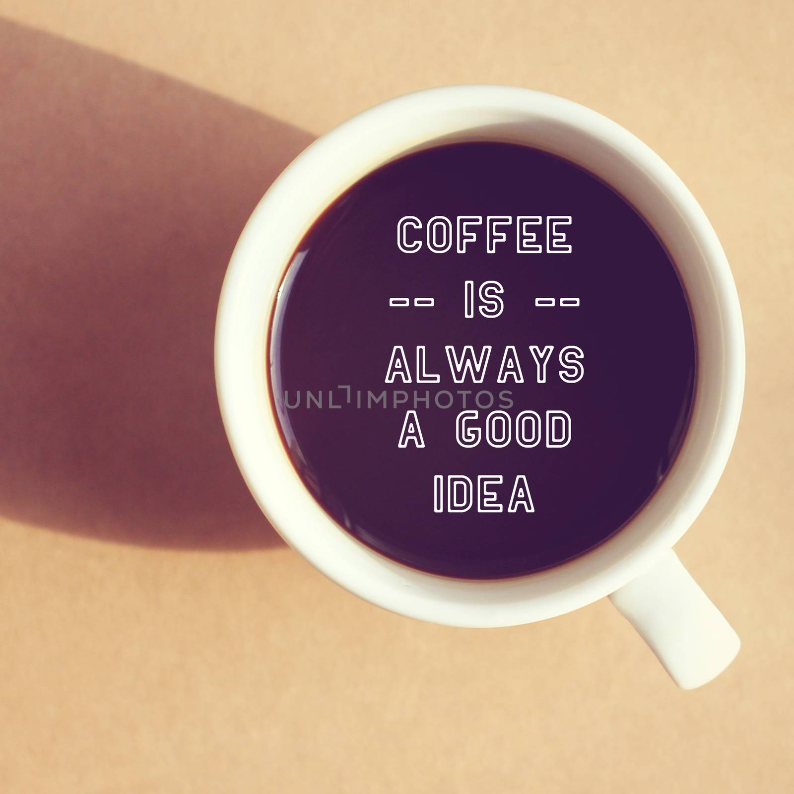 Inspirational quote on cup of coffee with retro filter effect