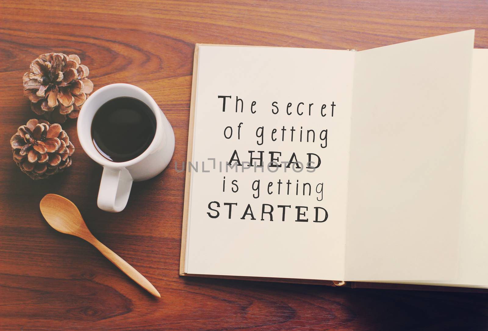 Inspirational motivating quote on notebook and coffee with retro filter effect