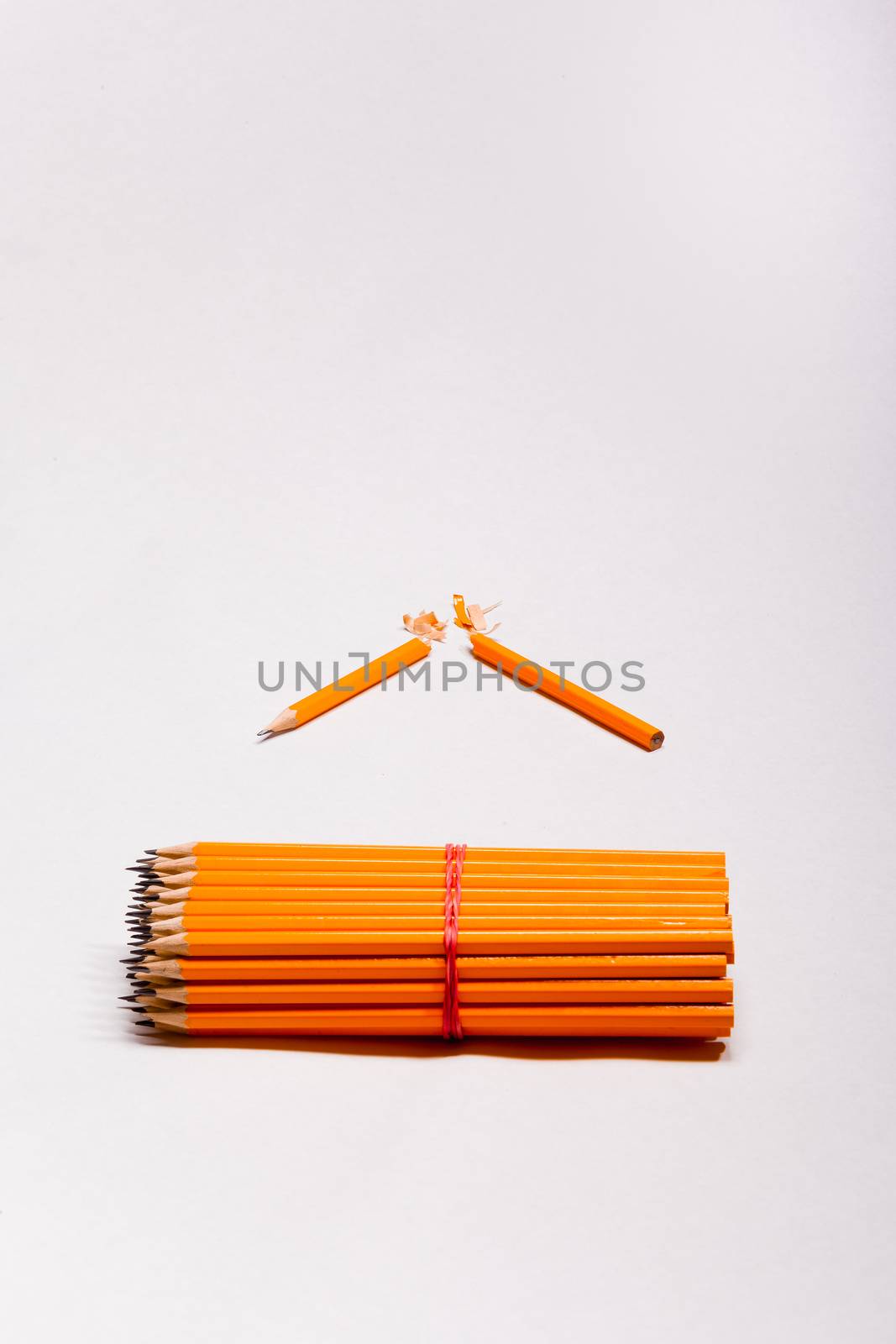 yellow pencils and a broken pencil by STphotography