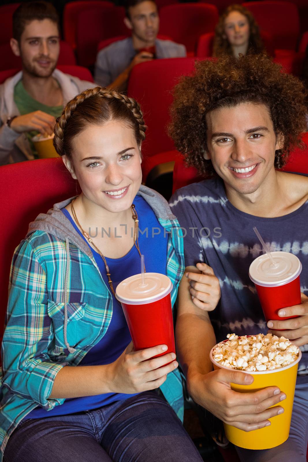 Young couple watching a film by Wavebreakmedia