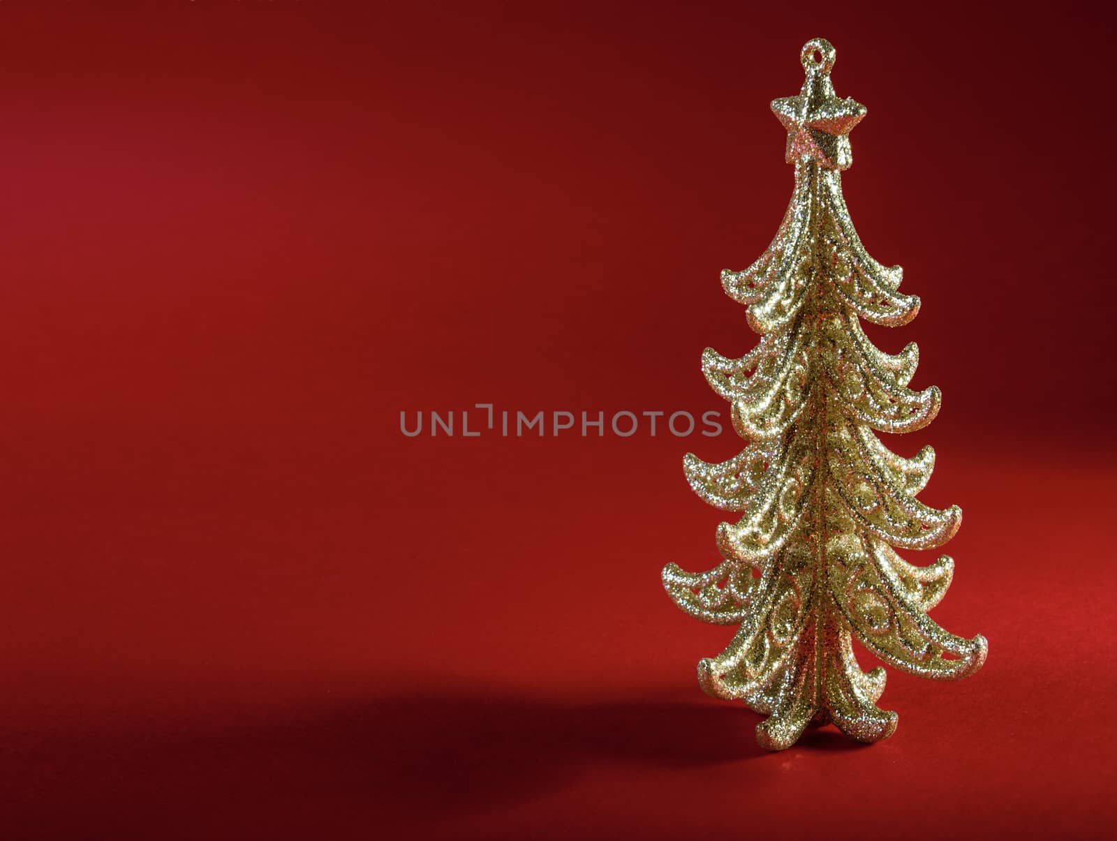 Christmas tree on dark red background