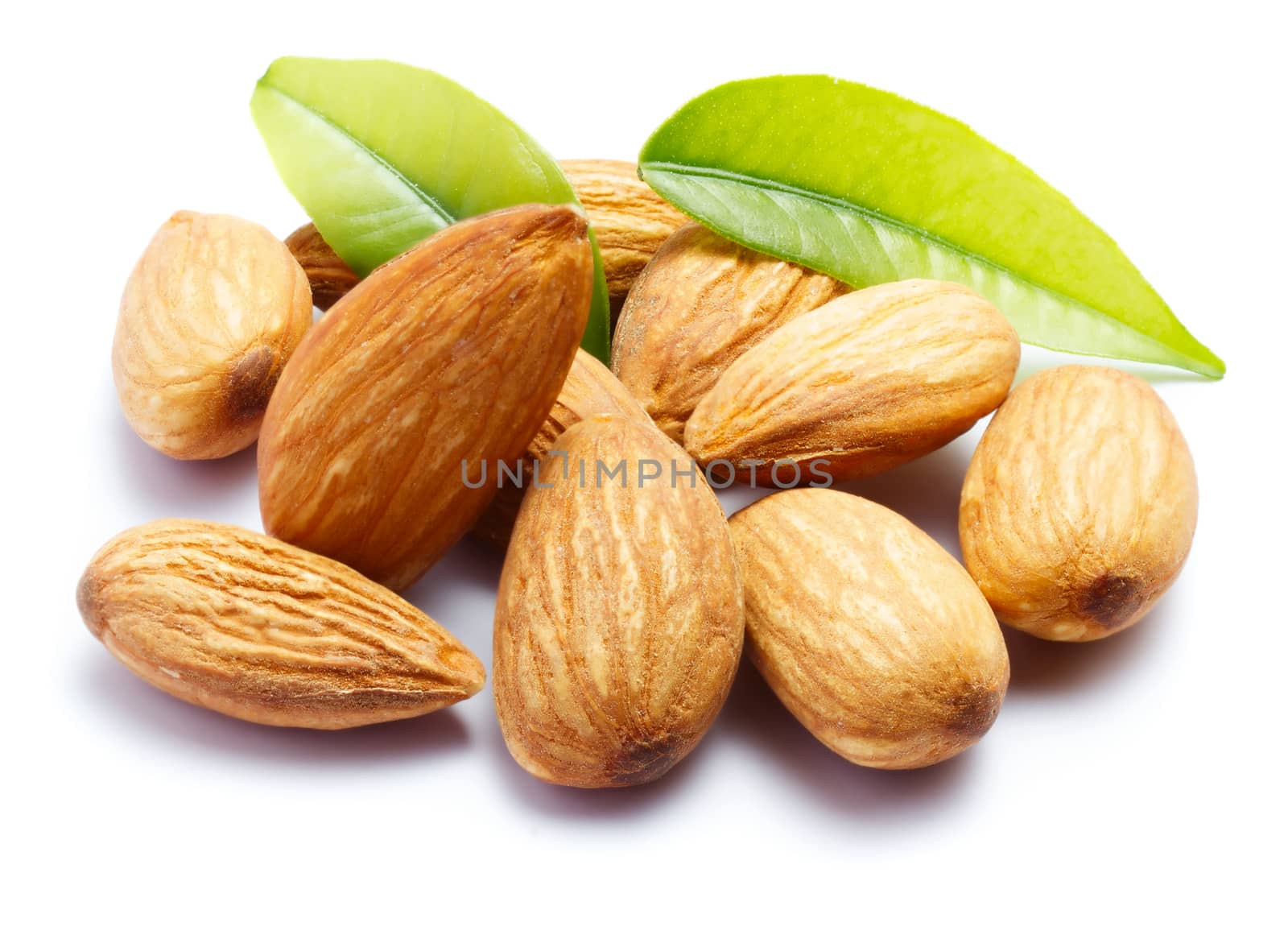 Almonds with leaves isolated on white background