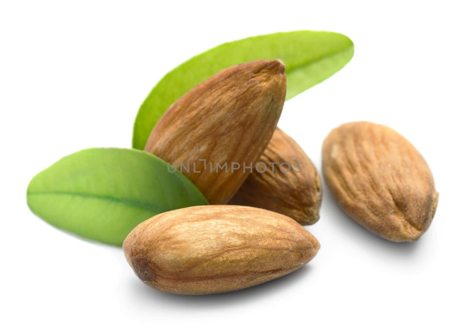 Almonds with leaves isolated on white