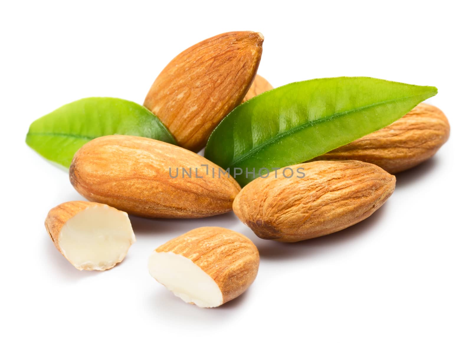 Almonds with leaves isolated on white background