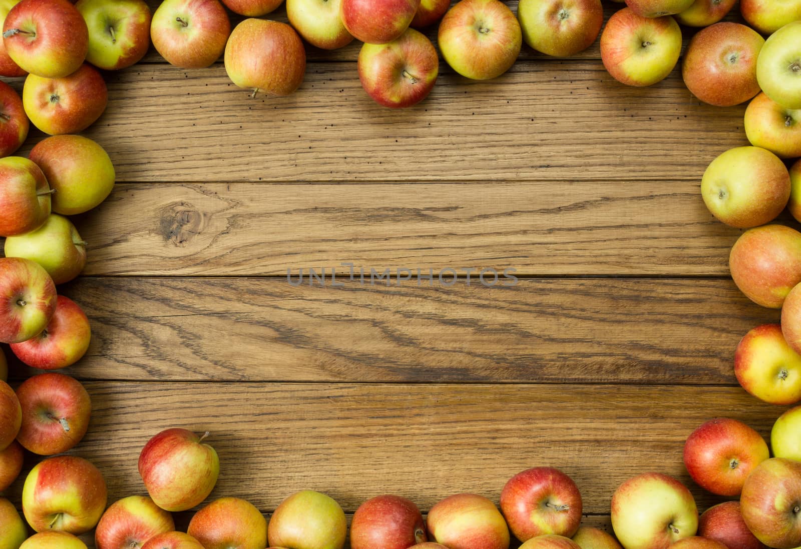 Apple frame on wooden background