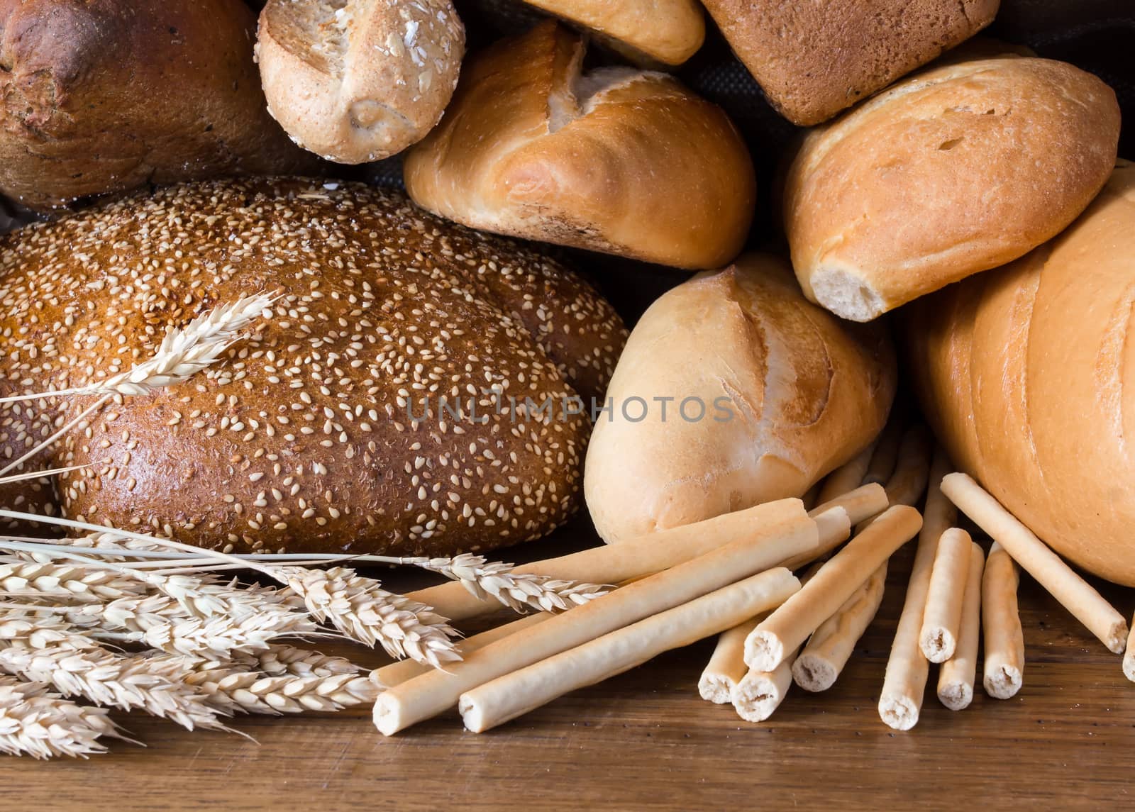 Bread assortment on wooden background